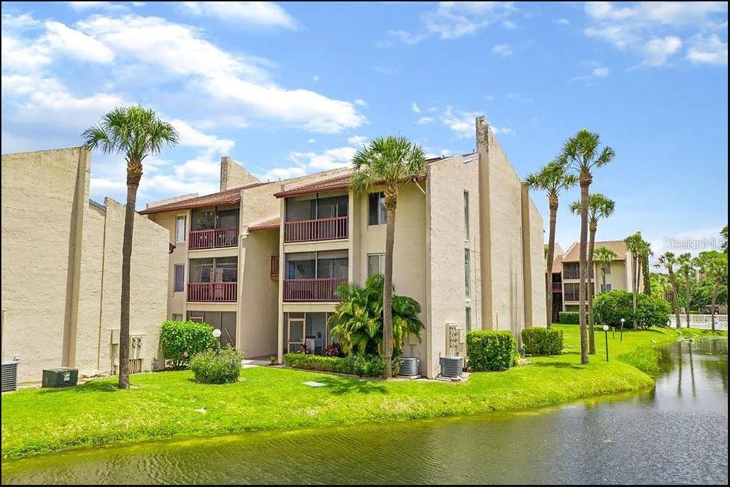 Experience carefree living in Carrollwood with this charming first-floor condo, nestled within a gated community. This low-maintenance home offers 1 bedroom, 1 full bath, and 710 square feet of living space, complete with a spacious screened porch perfect for enjoying the outdoors. The open-concept floor plan welcomes you with tile flooring throughout the living area and kitchen, while the bedroom features warm wood plank flooring and plenty of natural light. The kitchen includes a generous snack bar and ample counter space for all your storage needs. The living room is an ideal gathering spot, featuring a ceiling fan and sliding glass doors that open to the porch. The bedroom offers ample room for large furniture and boasts a large walk-in closet with built-in shelving and additional attic storage. The full bath includes tile floors and a spacious vanity. Step out onto the private screened patio to savor your morning coffee while taking in the peaceful lake view. The community is surrounded by mature trees and lush landscaping, and residents can cool off in one of three sparkling community pools, complete with extra deck space for sunbathing. Parking is plentiful, with remote gate access for added security. This quiet community is conveniently located just minutes from schools, shopping, and dining, with easy access to I-275 and close proximity to Raymond James Stadium. Tenant must apply with Whisper Lake Condominium HOA and be approved prior to move in (10 days prior). In addition to the advertised base rent, all residents are enrolled in the Resident Benefits Package (RBP) for $50.00/month which includes HVAC air filter delivery, credit building to help boost your credit score with timely rent payments, utility concierge service making utility connection a breeze during your move-in, and much more! More details upon application. Pets welcome! At the owner's discretion, 1 pet max, up to 50lbs, no aggressive breeds. Occupied//Available 11/01/2025!!