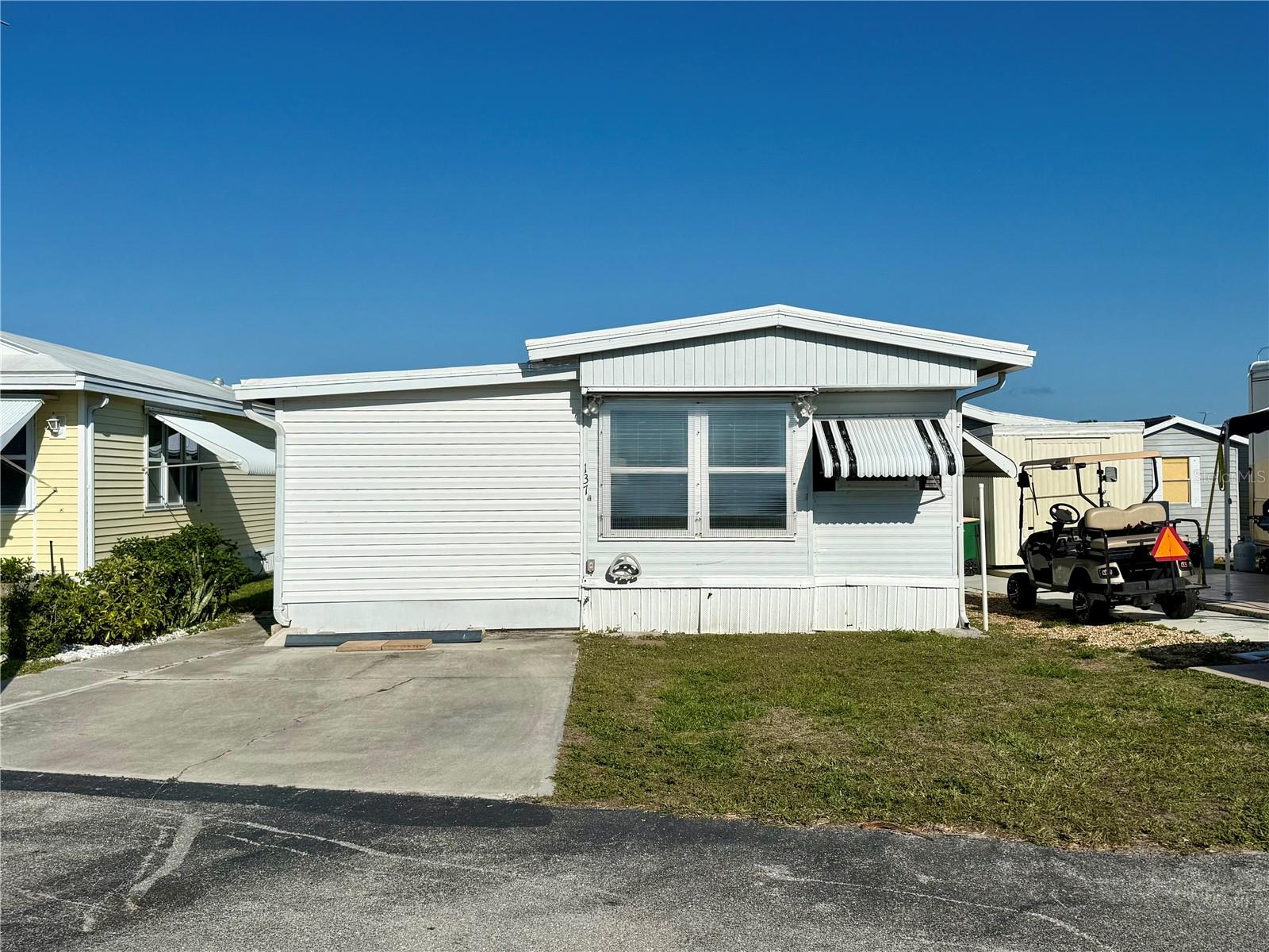 $15,000 PRICE REDUCTION!! Welcome to Holiday Travel Park - one of the most active 55+ communities you'll see, where most everyone knows your name!
<br>
In this mobile home park, YOU OWN THE LAND - no lot rents or land lease fees here!
And for the incredibly low fee of $140 per month, you'll get ACCESS TO ALL THE AMENITIES, PLUS SEWER, WATER & CABLE TV!
<br>
Lot 137 is situated on one of the wider streets in the park (Ave. E), and is centralized to all the park amenities.
<br>
<br>
Step inside this charming and structurally reinforced home (using extra anchor bolts), completely updated with stylish finishes, and 150 MPH-rated Hurricane windows. The stick built lanai features 2x4 's with 2" foam insulation in walls in lanai; NEW HVAC installed in 2024!! Not only did this home survive Ian, but it survived Helene and Milton with no damage! Step inside into the enclosed and cooled Florida Room (great for extra entertaining space, or for sitting in the sunshine. Head up the 3 stairs into the main living area of the home, featuring a quite spacious layout, dining area, kitchen, and coffee bar nook. Head back into the hallway to find the bathroom to your left, and walk-in closet to your right. Straight back is the bedroom, featuring bed, nightstands, and dresser. No washer/dryer at the home, but this property is very close to one of the communities many laundry halls.
<br>
<br>
We hope this one won't last long, especially since season is halfway through! Schedule your showing today!