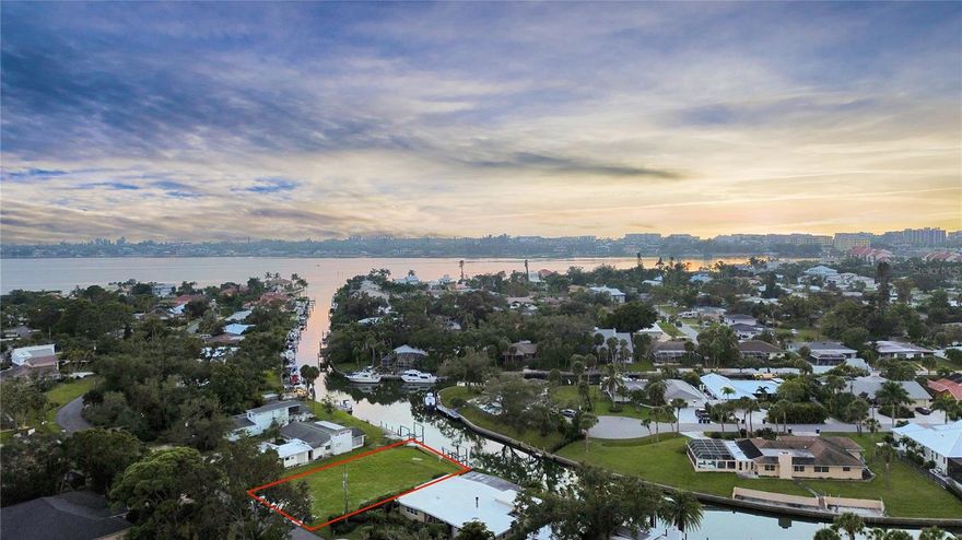 Welcome to 1849 Baywood Drive in Sarasota, Florida 34231 Situated on a .26-acre lot with an impressive 92-foot seawall, this cleared and ready-to-build property offers direct canal access to little Sarasota bay with no fixed bridges and just minutes from the Gulf of Mexico. The property is also walking distance to Siesta Key Beach, consistently ranked as America’s #1 beach, celebrated for its powdery white quartz sand and turquoise water. Whether you’re an avid boater, fisherman, or simply love being near the water, this property is your gateway to the quintessential Florida lifestyle. 

Imagine stepping out of your custom-built home and cruising through the open waters of Sarasota Bay in minutes, or exploring the turquoise waters near Midnight Pass, less than ten minutes away by boat. Living on a deep-water canal offers year-round enjoyment, from sunrise paddle boarding and kayaking to evening fishing and dolphin watching right from your own backyard. Local marine life includes snook, redfish, tarpon, mangrove snapper, and even gentle manatees that frequent these calm channels.

This highly desirable area of Sarasota has county-approved residential construction, saving you time and streamlining the path to building your custom coastal retreat. Custom builders in the area are well-versed in designing elevated, contemporary, and Key West–inspired homes to complement the waterfront setting—perfect for showcasing panoramic canal views and breathtaking sunsets.

Enjoy proximity to some of Sarasota’s finest amenities. Just 15 minutes to vibrant downtown Sarasota, residents can savor world-class dining, cultural attractions, and entertainment venues like The Van Wezel Performing Arts Hall, Marie Selby Botanical Gardens, and St. Armands Circle. 

From tranquil canal living to convenient access to Sarasota’s cultural and coastal attractions, 1849 Baywood Drive presents a rare opportunity to design your dream home and live the ultimate Gulf Coast lifestyle in one of Florida’s most prestigious waterfront neighborhoods.