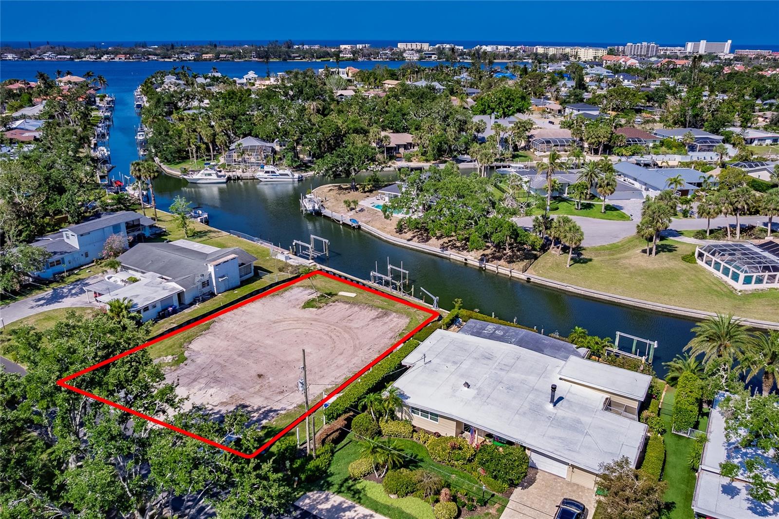 This incredible vacant lot offers the perfect canvas to build your dream home in paradise! Featuring an 92-foot seawall and direct water access, you’re less than 5 minutes from the Intracoastal Waterway—just a short boat ride to the stunning Gulf of America. With less then a 10 minute boat ride you can also enjoy the beautiful blue water from the midnight pass opening.
Located in a highly sought-after area, this lot has already been approved by the county for residential construction, saving you time and hassle. Enjoy the ultimate Florida lifestyle in a gorgeous setting just 15 minutes from vibrant downtown Sarasota, and within walking distance to Siesta Key Beach—ranked America’s #1 beach.
With shops, dining, and everyday conveniences just minutes away, this is a rare opportunity to create the waterfront home you’ve always envisioned in one of the most desirable areas on the Gulf Coast!