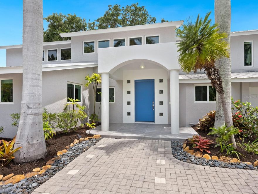 Lowest priced 4 bedroom canal front home on Siesta Key! Move-in ready, meticulously maintained residence located on a quiet cul-de-sac, yet within walking distance to award winning quartz-sand Siesta Key beach and picturesque Siesta Key village. Peaceful backyard with elegant decking, situated on 112 ft canal frontage with a 10,000 lb. boat dock and pool. Live here and the biggest decision you will have to make in a day is whether to go boating, paddle boarding, kayaking, jet skiing, to the beach, or lounge poolside. With the village 0.2 miles away, shopping and dining at the myriad of restaurants is an easy stroll, or a quick drive in your golf cart.  This immaculate, updated 3,614 square foot open floor plan retreat has 4 bedrooms and 4 baths, with a primary bedroom en-suite with walk-in closet on each floor. The game room can easily become a 5th primary bedroom en-suite, if desired. Relax and unwind in the serene great room with its beautiful wood beamed ceiling and views of the lush backyard, in the spacious bonus/media room, or in the upstairs stunning game room with pool table and bar. The dramatic two-story foyer filled with sunlit picture windows greets you as soon as you open the front door. The kitchen is a cook’s delight with maple cabinetry, granite countertops, a stainless prep area with separate sink, KitchenAid stainless steel appliances and recessed, under cabinet track lighting. You’ll have peace of mind with concrete block construction, metal roof (2012), energy efficient hurricane windows with warranty (2022) and shutters, and a ton of updates including luxury vinyl plank flooring upstairs (2022). The mechanicals consist of: 3 zoned A/C units (2015, 2016, 2018), 2 hot water heaters (2017, 2022), all KitchenAid appliances (2020), pool salt water system (2018), wine refrigerator (2024) and Pentair pool pump (2023). This warm and inviting luxury home is ready for you and the lifestyle you deserve.