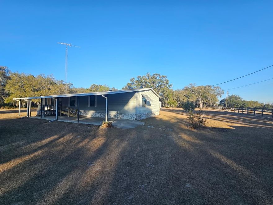 Beautiful 2.5-Acre Fully Fenced Property in Reeves Subdivision!

Enjoy peaceful country living on this cleared 2.5-acre property, featuring a spacious 3-bedroom, 2.5-bath doublewide home with approximately 1,600 sq. ft. of living area. The property includes two large outbuildings, providing plenty of storage or workshop space, and a convenient carport along the front of the home with a handicap-accessible wooden ramp.

Inside, you'll find a comfortable and well-designed layout:

Large primary suite with dual walk-in closets.
Ensuite bathroom featuring dual sinks, a soaking tub, and a walk-in shower.
Living room and separate family room with a wood-burning fireplace and sliding doors leading to the covered back porch
Spacious kitchen offering ample counter space, a breakfast bar for four, and a formal dining area — perfect for family dinners or entertaining guests.
This property combines functionality and space with a comfortable rural lifestyle — ready for you to move in and make it your own!
New roof in 3/2025. 4 ton 14 seer Bryant HVAC in 2/2021.