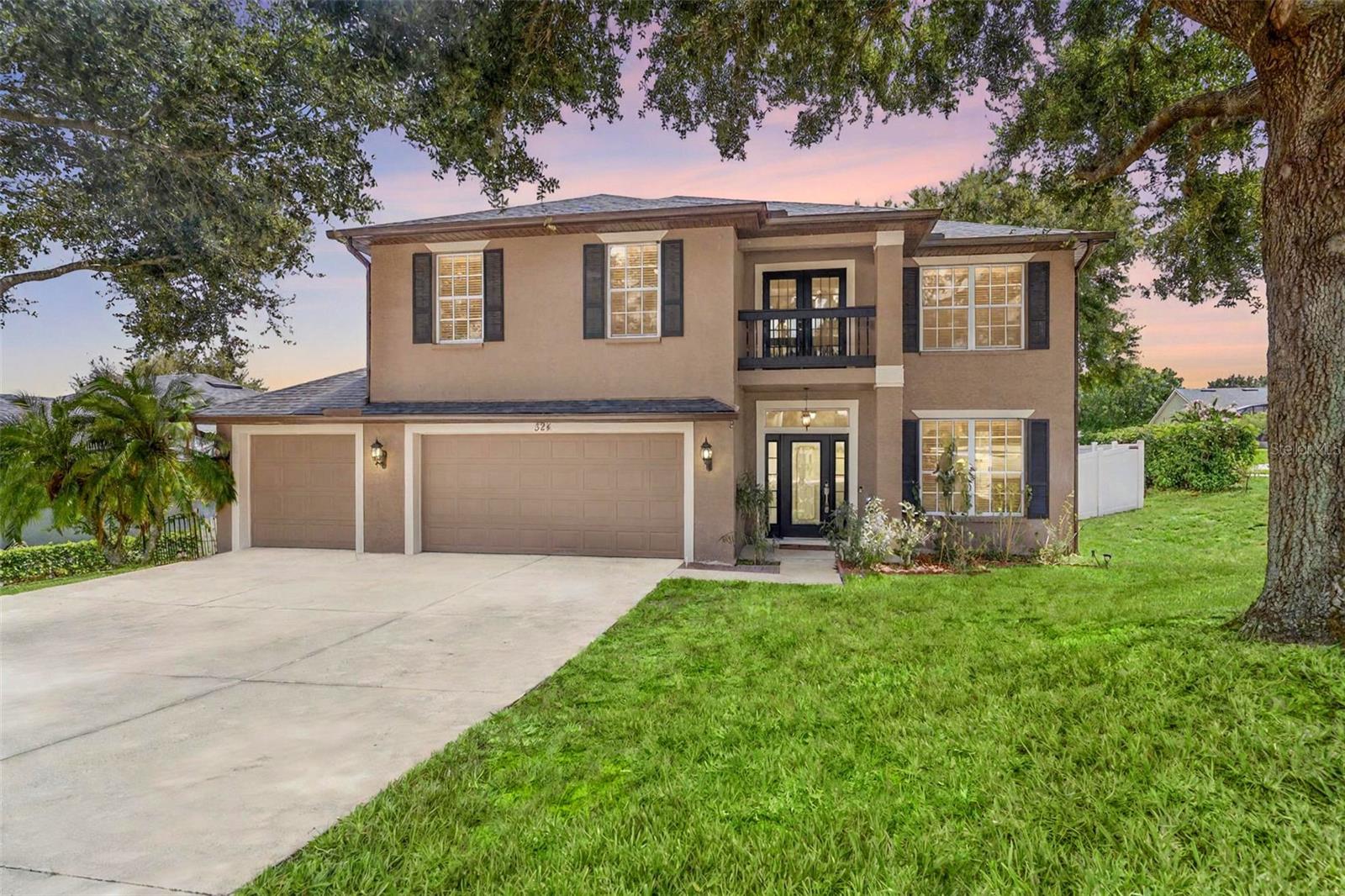 One or more photo(s) has been virtually staged. This corner lot, well updated DeBary Plantation home with a BRAND-NEW ROOF in 2025 and NEWER AC system in 2024 (the other is new in 2020) is ready to go! Boasting a 3-car garage and vinyl fenced back yard, this home is loaded with features. Inside, the spacious kitchen features granite countertops, 42” cabinets with crown molding, stainless steel appliances including the brand-new refrigerator and recessed lighting. One main living area has an electric fireplace while the other is adjacent to the kitchen and includes soaring ceilings and flows to the screened porch in the private back yard. The huge primary bedroom suite features a balcony, dual walk-in closets, and the ensuite bath includes a garden bath, dual sinks, water closet and walk-in shower. The private, rear screened porch in the fully fenced back yard has lake views and ceiling fans. Additional features include bullnose drywall, keyless front door, security and irrigation systems, tons of parking, and access to multiple swimming pools, including the one just down from your new home at the end of the cul-de-sac. DeBary Golf and Country Club is just down the street, whether you’re looking for the driving range, some golf, or just a quick meal in the restaurant. Ask your Realtor® for the link to the unbranded virtual tour of this amazing home. All measurements are approximate and should be independently verified.