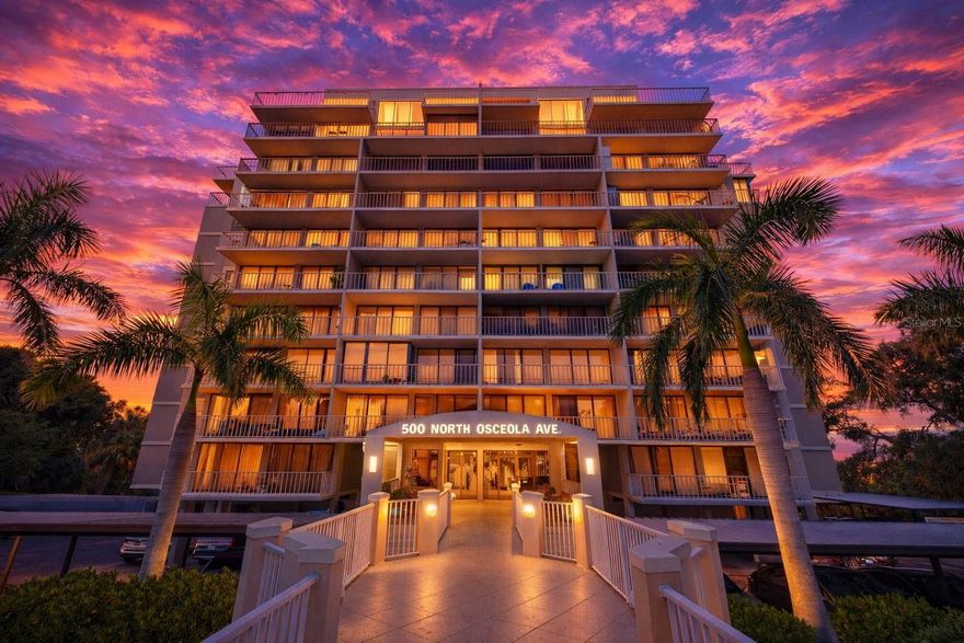 An exceptional offering of refined waterfront living, this stunning end-unit residence at 500 N Osceola Avenue, Unit 410 is a rare blend of luxury, light, and thoughtful design. Perfectly positioned to capture abundant natural light from multiple exposures, this impeccably updated 2-bedroom, 2-bathroom condominium lives like a private retreat in the sky. The open, designer kitchen has been beautifully remodeled and features newer appliances, a statement tray ceiling, and chic shaker cabinetry—blending form and function for both everyday living and elevated entertaining. The living and dining areas flow effortlessly to two private balconies, including an oversized primary balcony ideal for morning coffee, sunset views, or hosting guests in style. Both bedrooms are true ensuite retreats, each offering spa-inspired, remodeled bathrooms with sleek walk-in showers and refined finishes. Every detail has been carefully curated for comfort and peace of mind, including a 2025 HVAC system, 2024 40-gallon hot water heater, 150-amp electrical panel, Nest thermostat, and Whirlpool stackable washer and dryer. This residence may be offered fully furnished, presenting a truly turnkey opportunity for the most discerning buyer seeking effortless luxury. With its end-unit privacy, exceptional natural light, dual balconies, and extensive upgrades throughout, Unit 410 stands apart as a sophisticated sanctuary in one of Clearwater’s most desirable waterfront settings. A rare opportunity to own a light-filled, move-in-ready luxury condo where no detail has been overlooked.