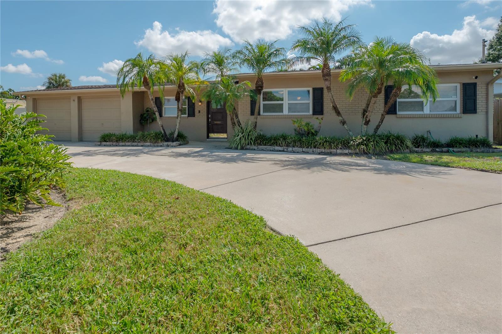 MORE PHOTOS TO COME... Freshly Remodeled Tampa Bay Area Retreat in Sought-After Dana Shores – Steps to Golf, Minutes to the Beach! Welcome to your laid-back Florida living in this newly remediated home with updates throughout. Inside, you’ll find a brand-new kitchen, luxury vinyl plank flooring, all new interior doors with upgraded hardware, a freshly painted interior for a crisp, inviting look... and MORE!
The home features FOUR bedrooms—two of which are PRIMARY SUITES. One suite, original to the home but thoughtfully modernized, includes a walk-in closet, a space-saving en suite bathroom, a ceiling fan, and a window that looks out toward the outdoor kitchen shaded by a large trellis. The newly added suite comes complete with a walk-in closet, a private en suite bath with a glass-enclosed shower with rain shower head, and a large picture window framing serene views of the tropical pool escape. The two additional bedrooms are evenly and nicely sized and designed for comfort, each featuring large windows, ceiling fans, and generous closets—perfect for family, guests, or flexible use. The main living areas flow effortlessly. An open family room offers expansive windows overlooking the backyard pool and covered patio, while the cozy dining space creates a warm setting for everyday meals or intimate gatherings. The current furnishings are arranged to define separate living, family, and dining spaces, but the layout is highly flexible and could easily be reimagined to suit your preferred flow. At the heart of the home, the ALL NEW kitchen blends style and function with wood cabinetry, solid-surface countertops, LED lighting, stainless steel appliances, generous counter space, and a versatile center island. Step outside to your own outdoor oasis. The free-form, crystal-clear pool is surrounded by swaying palms for privacy, expansive paver decking, a firepit for cool evenings, a trellis-covered outdoor kitchen with bar seating, two artificial turf areas, and a covered lanai for shaded lounging. A stepping-stone path leads to the convenient pool/guest bath—perfect for keeping the fun going without tracking water inside. All of this is set in Dana Shores, a sought-after neighborhood just steps from Rocky Point Golf Course, an 18-hole, par-71 course on the Florida Historic Golf Trail, and a short bike ride to the Skyway Trail. You’re also a short drive to Gulf beaches, public boat ramps, MICHELIN-rated restaurants, and two airports—including top-ranked Tampa International. World-class shopping, downtown Tampa, waterfront parks, and cultural attractions are all within easy reach.
More about the community at danashores.com and about the park at Skyway Sports Complex https://hcfl.gov/locations/skyway-sports-complex. Rocky Point Golf Course https://www.rockypointgolf.net/ Front door to be painted soon. Color in photos represents the new color to come.