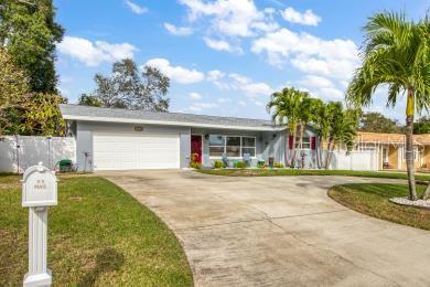 This charming 3-bedroom, 2-bath home with an oversized 2-car garage is located in a desirable area of Belleair Bluffs and is waiting for YOU! The circular driveway and beautifully landscaped yard create a welcoming approach to the home. As you enter the house, the open floor plan immediatley catched your attention. You will find a spacious family room that provides plenty of sapce for relaxation and quality time with love ones. The updated kitchen boasts granite countertops, a breakfast bar, stainlesss steel appliances and ample cabinet storage, making the space functional and applealing for everday cooking and entertaining. The primary bedroom features an extra-long walk-in closet, providing additional storage options, and an en-suite bathroom with a walk-in shower. For your outdoor enjoyment, there is a screened lanai and a paver patio perfect for relaxing on pleasant days. The immaculate landscape is maintained by the cost-effective well with pump for the sprinkler system. The 2-car garage offers extra space for the washer/dryer, and a work bench area, providing convenice and versatillty. This home is situated in a No-Flood Zone, High & Dry but so close to the water. This Largo/Belleair location gives you proximity to various amenities such as the Belleair boat ramp, the beautiful Gulf Beaches, county parks, the Pinellas Trail, shopping, dining and much more.