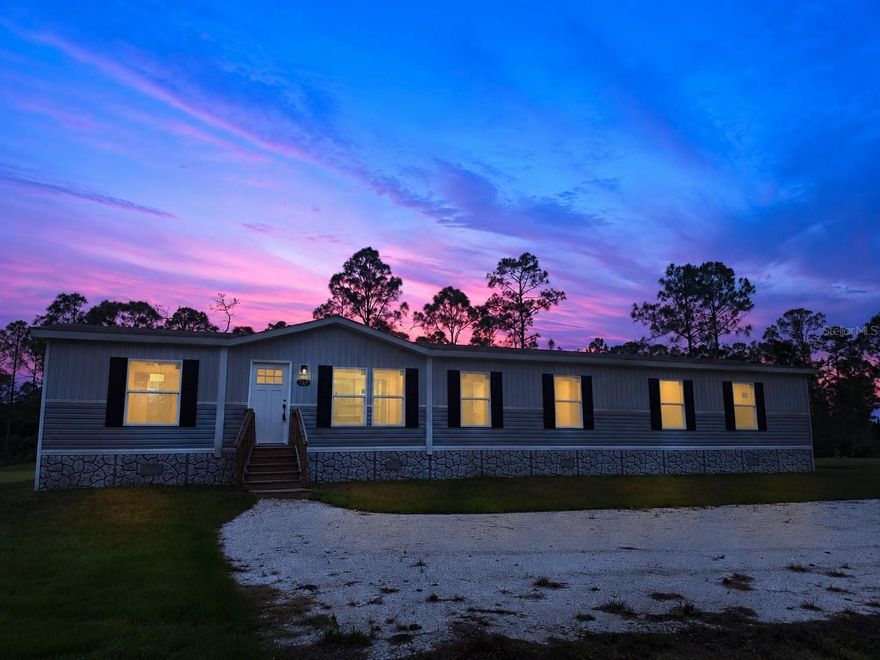 Some people spend years searching for land like this in Southwest Florida. The moment you turn onto the quiet road and the sky opens wide around you — that's when you know. This is the Charlotte County Ranchettes, and it feels like peace, calm, and home. This five-bedroom, three-bathroom manufactured home sits on 1.25 acres of agriculturally zoned land in Charlotte County, Florida — one of the most sought-after rural communities in Southwest Florida for buyers looking for horse property, hobby farm land, or acreage with room to build a self-sufficient lifestyle. Five bedrooms gives you the flexibility buyers are actively looking for: a primary suite, kids' rooms, a dedicated home office, and a guest room that earns its square footage. Three full bathrooms means the house functions at full capacity without the daily friction. The open-concept floor plan connects the kitchen, dining, and living areas in a layout built for how families actually move through a home — not how a floor plan looks on paper. The kitchen anchors the space with room to cook, gather, and linger. Agricultural zoning is the feature buyers searching for horse property in Charlotte County, FL or small farm acreage in Southwest Florida are specifically looking for — and this property has it. Raise horses, keep livestock, plant a working garden, or simply hold the land as an investment in your quality of life. ATV riding, horseback trails, and open-sky evenings aren't the exception here. They're the norm.  This property is well-suited for families relocating to rural Southwest Florida, buyers seeking acreage homes with agricultural zoning in Charlotte County, snowbirds looking for a private seasonal retreat, and anyone ready to trade a crowded neighborhood for land, privacy, and breathing room. If you've been searching for acreage property in the Charlotte County Ranchettes, this is the one worth seeing in person.