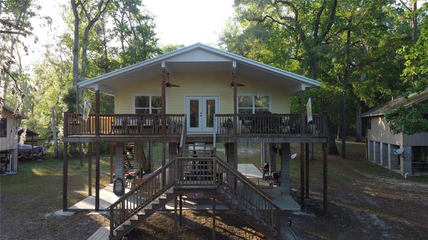 Charming Riverfront Retreat – Your Dream Home Awaits! Discover the serenity of riverside living with this beautiful two-bedroom, one-bath home right on the picturesque Santa Fe River! The kitchen features stainless steel appliances and a well-placed window above the kitchen sink for natural lighting. This spring-fed paradise offers deep-water access, allowing you to cruise to the Gulf of Mexico—perfect for fishing, kayaking, or simply enjoying the tranquility of nature. Key Features: - Located just down from the Ichetucknee River. - Waterfront Bliss: Enjoy direct access to the sparkling waters of the Santa Fe River, surrounded by lush, mature trees that provide privacy and shade. - Convenient Amenities: Equipped with a conventional septic system and well, ensuring you have everything you need for comfortable living. - Community Perks: Join the Three Rivers Estates Homeowners Association for just under $200 a year, granting you access to delightful parks, scenic boat ramps, and additional amenities to enhance your lifestyle. Imagine waking up to the sounds of nature, sipping your morning coffee while taking in stunning river views, and spending afternoons exploring countless water adventures. Whether you’re looking for a serene getaway or a place to call home, this property is the perfect blend of comfort and nature. Don’t miss out on this incredible opportunity to own a piece of paradise on the Santa Fe River! Contact us today to schedule your private showing!