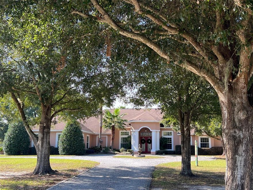 Location! Location! Location! This fabulous mini farm is literally adjacent to World Equestrian Center in a private gated community. A fabulous 4 bedroom, 4 bath home with a beautiful lagoon style pool, spacious office/den, summer kitchen with fireplace. A CB 4 stall barn with oversized stalls and a full 2-bedroom apartment complete this excellent property.