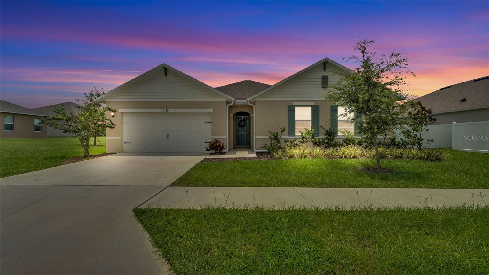 Welcome to Wind Meadows South – one of Bartow’s premier new home communities! This better-than-new residence boasts the highly sought-after Denton floor plan – now no longer offered by the builder – making this an exceptional find. Situated on an extra-wide lot with no rear neighbors, this home offers privacy, space, and a thoughtfully designed open layout.
The heart of the home seamlessly connects the living, dining, and kitchen areas, creating an inviting space perfect for both daily living and entertaining. The split-bedroom design places the three spacious secondary bedrooms in their own private wing, while the owner’s suite enjoys peaceful seclusion at the rear. The luxurious ensuite features a double vanity with granite countertops, a large walk-in closet, and a beautifully appointed bath.
The kitchen is a chef’s delight, complete with a large granite-topped island, full stainless steel appliance package (including refrigerator, microwave, range, and dishwasher), and a perfect view into the great room. Step outside to an extended covered lanai – a $20,000 upgrade added after closing – overlooking a large backyard with plenty of room for a future pool.
Wind Meadows South residents enjoy resort-style amenities including a sparkling community pool, playground, and two dog parks. Located just minutes from Highlands Publix Shopping Center and everyday conveniences, this home still has that fresh “new build” feel – without the wait!
Don’t miss this rare opportunity to own a Denton model in a prime location – schedule your private showing today!