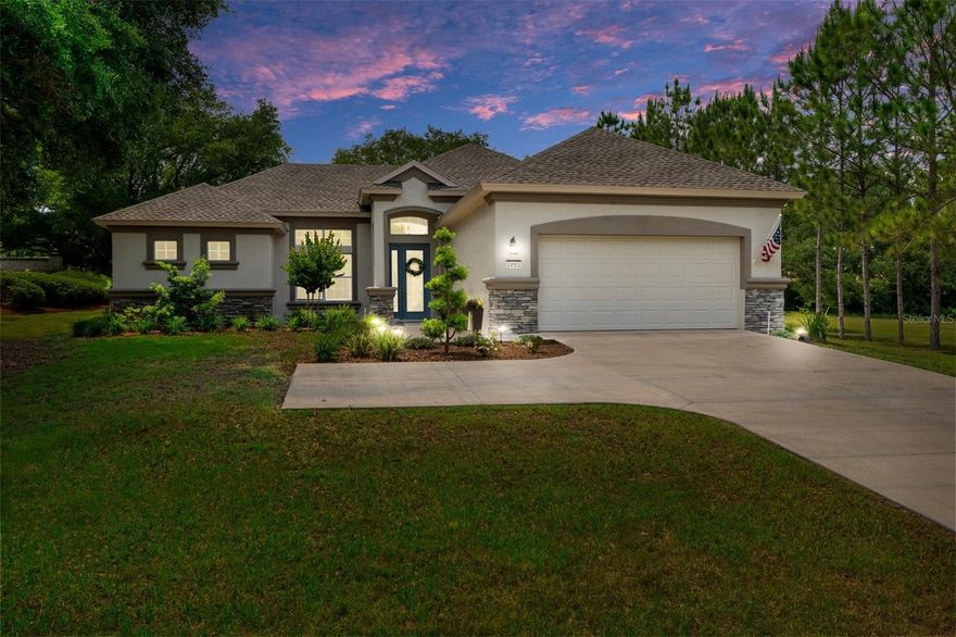 THE BEST OF BOTH WORLDS awaits in this beautifully upgraded 3-bedroom, 2-bath “Regina” model in Citrus Hills, complete with coveted membership to Citrus Hills Golf & Country Club. Ideally located just outside Terra Vista, this nearly new home offers easy access to all community amenities—without the premium of living inside Terra Vista. Designed to impress today’s discerning buyer, this home features luxury vinyl plank (LVP) flooring, crown moulding, granite countertops, subway tile backsplash, stainless steel appliances, a generous pantry, and upper cabinet crown toppers. The energy-efficient design is complemented by charming exterior stone accents and high-impact, thermal windows. Enter through a leaded glass front door into a light-filled open concept layout with current neutral tones—an inviting canvas ready for your personal touch. The split floor plan ensures privacy, placing the primary suite on one side and two additional bedrooms and a full bath on the other. The spacious laundry room includes a utility sink, storage, and space for a second fridge or freezer. (Note: the current laundry room fridge from 2024 will be moved to the kitchen and is included with the sale. Kitchen fridge does NOT convey, but is negotiable.) Enjoy Florida living in the landscaped backyard featuring a covered lanai, paver patio, and firepit—ideal for relaxing or entertaining. An added bonus: the backyard shed offering extra storage. Take in golf course views of the Meadows across the street, and reach the Pro Shop and Tiki Bar by golf cart. The Activity Center—with pool, pickleball, and more—is even closer. Located just 15 minutes from the Gulf, safe from storm surge, and perched 104 ft above sea level, this home requires no flood insurance. Enjoy peace of mind with its hurricane-ready construction, including an anchored roof, reinforced garage door, and impact-resistant features. Experience modern comfort, world-class amenities, and the unmatched charm of Citrus Hills living in Florida’s Nature Coast.