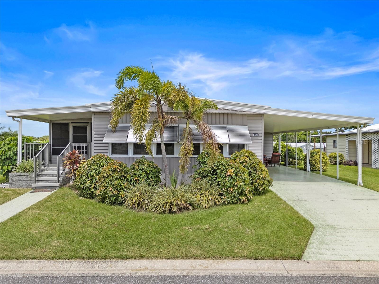 Welcome to one of the best Turn Key deals in Tidevue Estates! Located in a vibrant 55+ land-owned community, this delightful residence boasts an open concept design that seamlessly combines the kitchen, dining room, and living room—ideal for hosting friends and family. The spacious kitchen is a dream, featuring ample cabinetry and an inviting eat-in island that enhances the connection to the living area. Step through the living room and into the sunlit Florida Room, adorned with numerous windows that flood the space with natural light. Doors lead out to a cozy front porch and a serene backyard, perfect for relaxation. The primary bedroom is a true retreat, complete with an ensuite bath that includes a generous walk-in closet and a luxurious walk-in shower. Your guests will feel right at home in the secondary bedroom, which offers two wall closets for all their belongings. The guest bath is equally spacious and conveniently located just across the hall. Tidevue Estates is a haven of serenity intertwined with excitement, offering a wealth of activities to keep you engaged and entertained. HOA features include a community pool, library, fitness center and more. With a low fee of only $600 a year, what more could you ask for! Recent updates to the home include: New Siding (2021), New FL Rm Screens (2025), New Vapor Barrier & Subfloors in Great Room & Primary Bedroom (2018), New Subfloor & Carpet in Guest Room (2025), New Luxury Vinyl Plank in Kitchen & Primary Bath (2018). Whether you're a snowbird or a year-round resident, this is the perfect destination for you! This home is being offered Turn Key. Is this home your perfect match? Book your showing today!