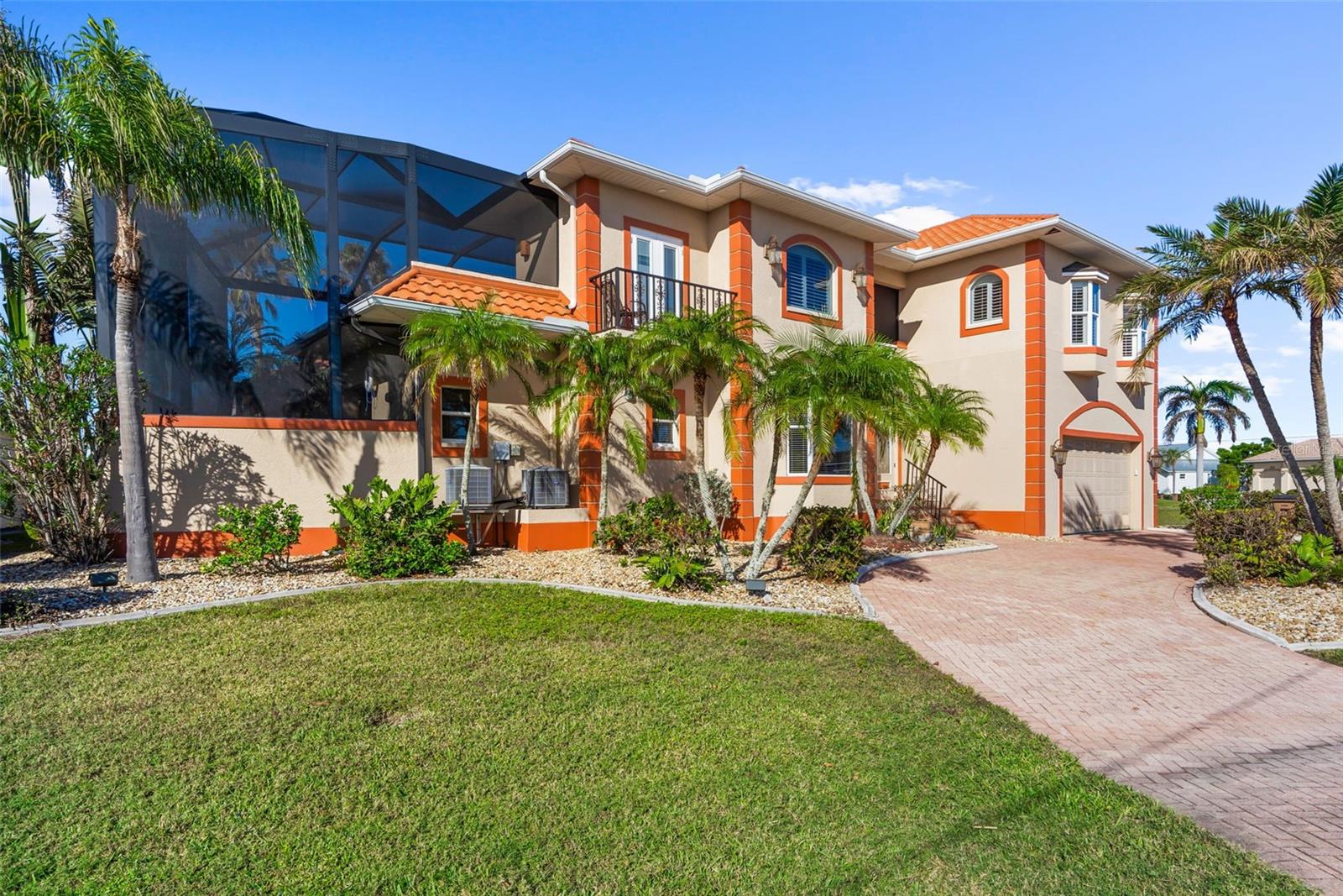 NEWLY REMODELED! Welcome to this stunning 4-bedroom, 3.5-bathroom Hacienda COURTYARD-style home, offering the perfect blend of luxury, comfort, and waterfront living. Situated on a sailboat-access canal in Coveted Punta Gorda Isles Florida, this property boasts an oversized seawall, ideal for boaters and water enthusiasts. The home features a 2023 roof and a new clear view pool enclosure, providing a pristine outdoor space to relax and entertain. Step inside to find an open floor plan that seamlessly integrates the kitchen, living room, and dining area, making it perfect for family gatherings or hosting guests. The spacious kitchen includes high-end finishes and ample storage, while the large living and dining areas are full of abundant natural light and views of the courtyard. For added privacy, the first-floor primary bedroom suite is a tranquil retreat with an en-suite bathroom designed for relaxation. The property also includes a private in-law or cabana suite, offering a separate living area for guests or extended family. The Courtyard oasis features a sparkling pool/Spa, perfect for enjoying Florida's year-round sunshine. The outdoor bar is ideal for entertaining, while the paver driveway and metallic epoxy garage floor complete the home's polished look, offering both beauty and functionality. This home is the ultimate in modern coastal living, combining convenience, privacy, and waterfront access Sailboat water with a quick out in a prime location. Punta Gorda, Florida, offers excellent water access, ideal for boating and fishing. Fishermen's Village is a popular waterfront hub with shops, restaurants, and a marina. Lashley Park features a public marina and boat ramps with access to the Peace River. Burnt Store Marina, one of the largest in the area, offers over 500 slips and easy access to Charlotte Harbor. These locations make Punta Gorda a prime destination for water enthusiasts.