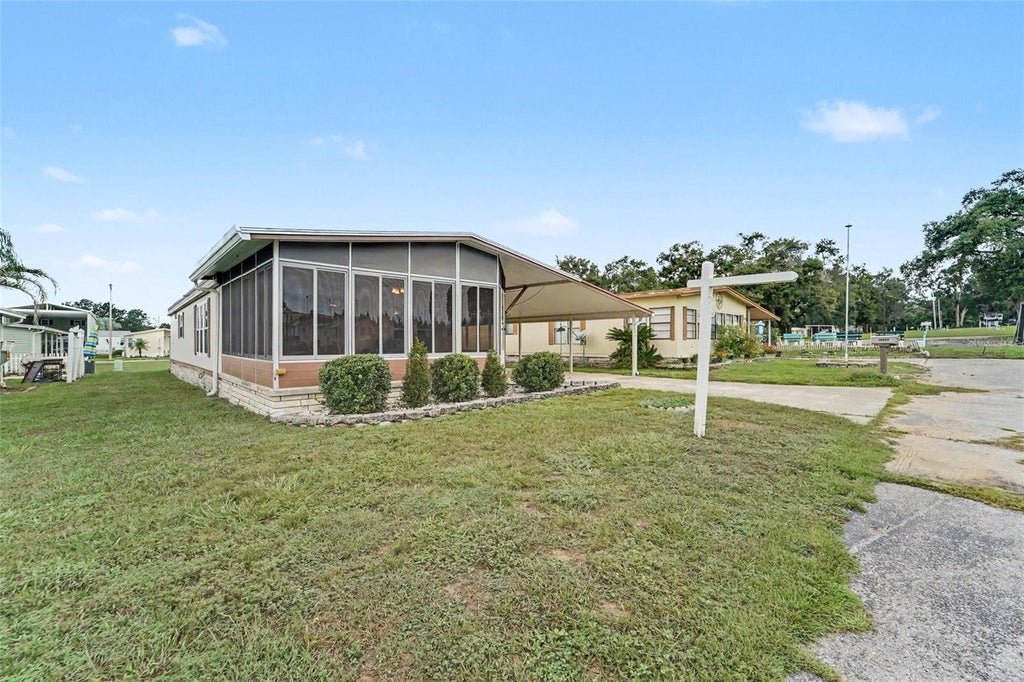Photo of 10055 Collingwood Avenue, Dade City, FL 33525 (MLS # TB8555054)