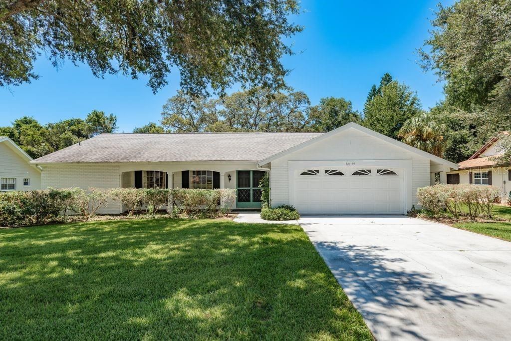 Photo of 12779 Ironwood Circle, Hudson, FL 34667 (MLS # TB8413832)