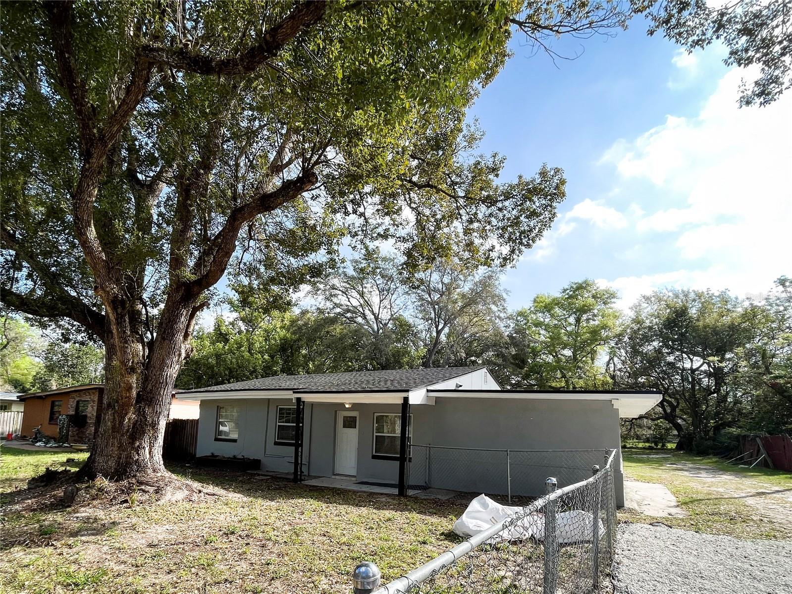 Introducing this gorgeous 4 bedroom, 2 bathroom home located in a desirable community! It has recently been remodeled and features over 1500 square feet of living space. The entire home is complete with beautiful hard flooring throughout that adds an extra touch of luxury. You will love the screened in porch that overlooks the trees, perfect for those summer nights to relax and enjoy your outdoor space. This conveniently located property allows you to be close to shopping, restaurants, and major roads. Don't miss out on this amazing opportunity! Schedule your private showing today before it's gone!