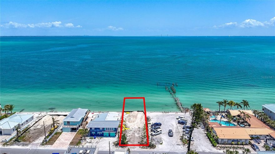 Prime waterfront lot located in Anna Maria. This rare vacant parcel offers direct water frontage. Property is cleared and ready for construction, providing the perfect site for a custom coastal residence. Situated on a quiet street within close proximity to beaches, shopping, dining, and island amenities.  Enjoy wide water views and direct view of the Sunshine Skyway Bridge. Don’t miss this exceptional opportunity to build your dream home on the water in Anna Maria.