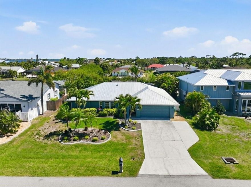 Short Sale. Waterfront living at its best, with quick easy access to fast water, and one bridge to the Gulf (approximately 28 feet of clearance).  Fish from your own dock or effortlessly launch your boat from the safety of your own boat lift.  This is a slice of Florida paradise, where indoor comfort meets effortless outdoor living. This beautifully designed single-family home features an open great room floor plan, seamlessly blending the kitchen, living, and dining areas into one inviting, light-filled space perfect for both everyday living and entertaining.

The heart of the home is the stylish kitchen, complete with stone countertops, a center island with stainless sink, soft-close drawers, and a dedicated wine cabinet, ideal for hosting or unwinding at the end of the day. Just off the main living area, you’ll find a bonus Florida room under air at the back of the home, offering additional flexible space for relaxation, hobbies, or gatherings.

Step outside to your private backyard retreat featuring a heated pool, expansive paver deck, and a generous shaded overhang, perfect for enjoying Florida’s sunshine while staying cool and comfortable. 

Inside, the home is finished with tile flooring throughout the main living areas and luxury vinyl in the bedrooms, combining durability with modern style. The spacious primary suite overlooks the pool, creating a serene escape, while the ensuite bathroom includes direct access to the pool area, adding convenience and a true resort-style feel.

Additional features include an indoor laundry room and a two-car garage, completing this well-appointed home.

Whether you're entertaining guests or enjoying a quiet evening poolside, this home offers the ideal blend of comfort, functionality, and Florida charm. This home has been lovingly cared for and many improvements have been made.  Please request the Amenities List for a full summary. Improvements include: 2026 New Pool Pump, 2023 Impact Windows Installed, 2023 Pool Cage Replaced and 16 foot Lanai Extension added, 2021 Dock improvements including new Trex decking with power and water, and two new boat lift motors, 2020 New Pool Heat Pump, 2020 New Metal Roof Installed, 2018 New AC.  Interior improvements include the addition of an R/O Filtration System in 2023, and a remodeled guest bath.