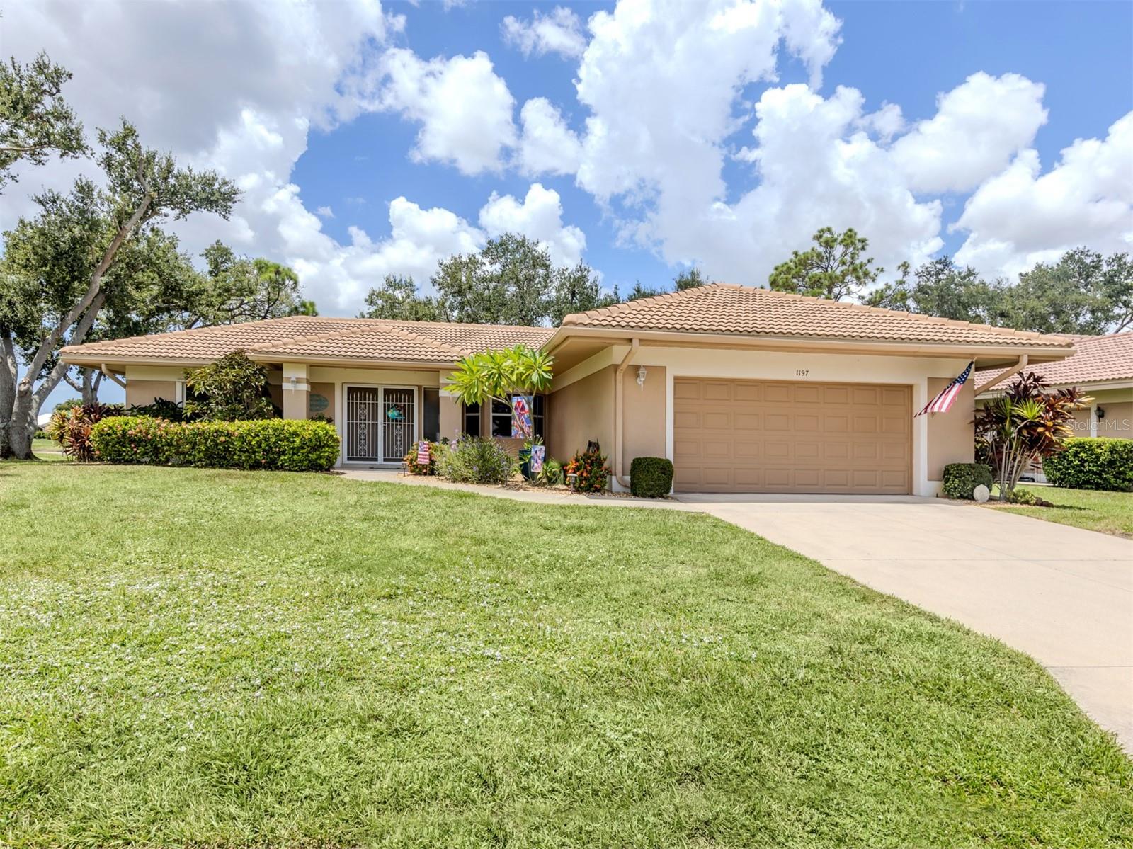 COASTAL CHIC best describes this spacious home in Willow Springs, a quaint pet-friendly community of only 77 owners with abundant amenities including heated community pool, spa, clubhouse, library, pickleball/tennis, shuffleboard, and fitness room. Located on a large corner lot, this open-concept home in a quiet setting is sure to please. | LAYOUT: Flexible design works for many lifestyles — whether you prefer a large dining room with a living area, a living room with workspace, or a wide-open great room. Oversized lanai is perfect for gathering, relaxing, or enjoying the Florida sunshine. Newer screened enclosure. | KITCHEN FEATURES: Updated with quartz counters, subway tile backsplash, stainless steel appliances (new dishwasher 2025), counter-depth refrigerator, and updated white cabinetry with glass-front accents. Expanded layout offers additional cabinet storage, counter space, and a breakfast nook overlooking the courtyard. | PRIMARY SUITE: Remodeled en suite bath with walk-in shower and dual sinks. Split-bedroom plan offers privacy for the coastal-themed guest bedroom. | FLOORING: Luxury vinyl plank in a warm neutral tone throughout, with tile in the primary bath and laundry. | UPGRADES: Electrical service panel (2023), garage door (2020), roof (2018), AC (2018), repipe meter-to-house (2006). | OTHER DETAILS: Low HOA fee with no CDD. Prime Venice location close to downtown, beaches, dining, and I-75 in under 10 minutes.