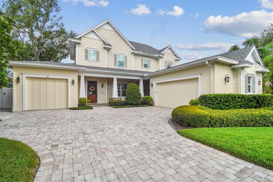 Welcome to this stunning Craftsman-style estate in the highly sought-after Golfview neighborhood of South Tampa. This meticulously designed 5-bed, 4-bath home offers over 4,200 square feet of heated living space and more than 1,100 sq. ft. of covered outdoor areas. Built in 2016 on a 75x100 lot in Flood Zone X, the home features a split 3-car garage with ample guest parking. From the moment you arrive, the home makes a grand impression with its covered front porch, wooden staircase, paneled walls, and abundant natural light. Inside, you'll find hurricane-impact sliding glass doors and windows, rich crown molding, coffered ceilings, and custom light fixtures throughout. The formal dining room sets a refined tone, while the dry bar and arched entryway lead you into the heart of the home: an open-concept kitchen, breakfast nook, and great room designed for both everyday living and entertaining. The oversized island is the centerpiece of the space, and customized with Thermador appliances, a walk-in pantry, built-in butler’s pantry/wet bar, and a large mudroom/laundry room with sink and ample storage. The private first-floor primary suite is a serene retreat with vaulted ceilings, paneled walls,  and direct access to the pool and lanai. Its spa-like bath includes a walk-in glass shower with dual shower heads, a freestanding soaking tub, dual vanities with storage, and a spacious walk-in closet. A second first-floor bedroom and full bathroom offers flexibility as a guest room or dedicated office. Upstairs, you'll find three generously sized bedrooms—each with walk-in closets and custom lighting—two full bathrooms, and a versatile loft area perfect for play, study, or relaxation. Attic access is available through the mechanical room for additional storage. Step outside to discover the ultimate outdoor lounge—virtually hidden from the rest of the house and other outdoor living spaces. Complete with a cozy gas fireplace, large built-in TV, stained wood ceilings, and ceiling fans, it’s the perfect setting for gameday gatherings or relaxing movie nights. The expansive backyard lanai features travertine decking, a gas feed and vent ready for your dream outdoor kitchen, and a 392-square-foot in-ground concrete pool (installed in 2017) surrounded by vinyl fencing and a grassy play area. Open space behind the property offers tranquil views of the ever-changing sky, adding to the sense of privacy and serenity. Located just minutes from top-rated restaurants, shopping, Palma Ceia Golf and Country Club, and only half a mile from Plant High School this home is a rare blend of craftsmanship, comfort, and coastal charm. Schedule your private showing today and experience the lifestyle you’ve been dreaming of.