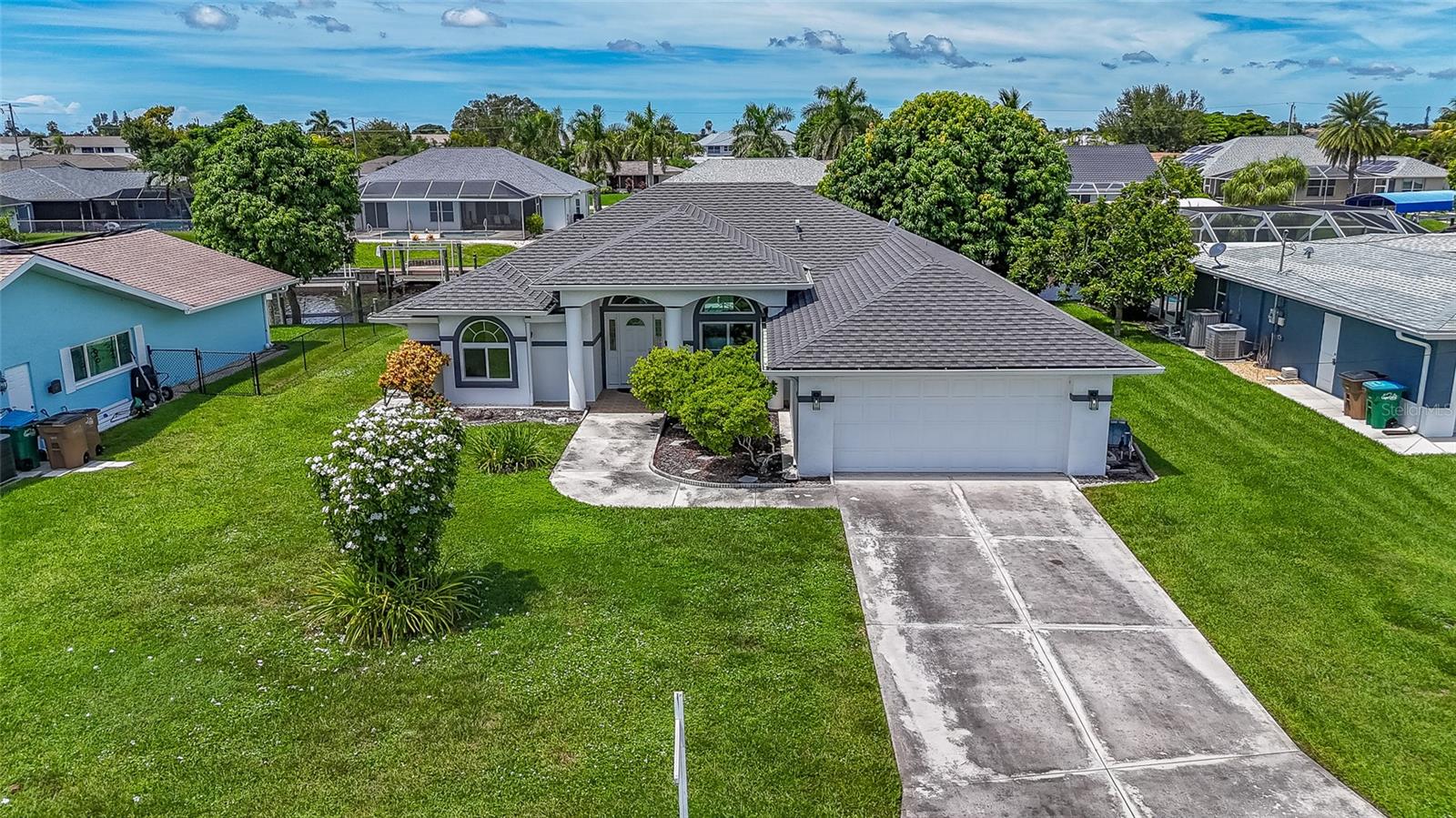 Waterfront, gulf access, 3 bedroom plus flex area and 2.5 baths. Open floor plan with split bedrooms and over 220 sq feet under air. Tile and laminate floors ( no carpet ). The master suite has tray ceilings, his and her closets and the adjoining bath has a tub and a shower. Private bath enclave and dual sinks complete the master bath. The under truss lanai will provide space for all your entertaining ideas and has a separate pool bath for company and the folks in the pool. Two car garage with impact garage door, new exterior paint, Updated pool pump and a concrete dock. 2022 New high end roof and super quality impact windows and doors.