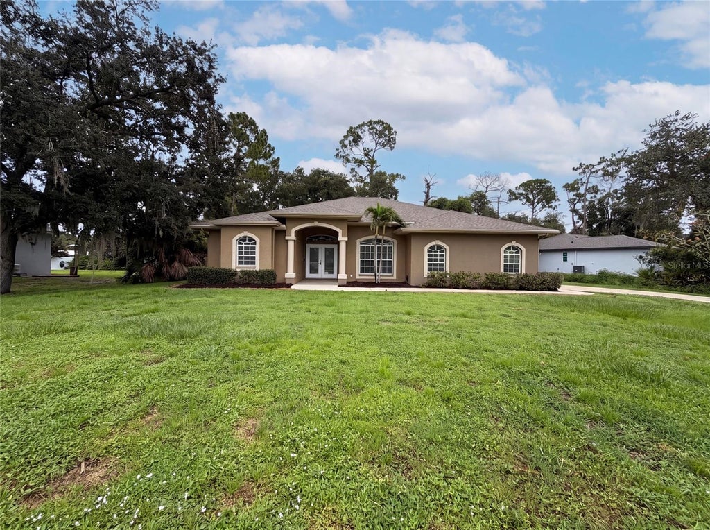 Photo of 1796 Nora Lane, North Port, FL 34286 (MLS # O6431172)