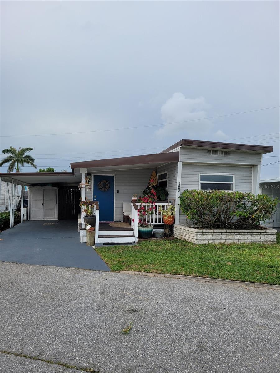 Come escape to your ideal winter retreat! Or better yet, let this be your PERMANENT Florida home! This charming abode features 2 nicely sized bedrooms and 1 large bathroom with beautifully tiled full tub & shower. Showing real "Pride of Ownership" throughout all it's spaces, this home has plenty to offer at such a low price. From the expansive and welcoming Living Room, to the large open plan Dining Room/Kitchen combination, and beyond. You will truly love living here! You will have maximum privacy inside and out with your well appointed Primary Bedroom at the rear of your home, and a large 2nd bedroom that can double as a private office space, game room, or whatever you desire. And your outdoor spaces, oh my! The beautiful garden sets a serene tone, leading to a backyard paradise enclosed by a high wooden fence for ultimate privacy. You can enjoy two inviting seating areas outside and a large eat-in kitchen inside, perfect for hosting or enjoying a quiet meal. With all the special areas this home has, it really lives large, offering you a cozy yet spacious retreat. But wait, there's more! This home has tons of extras, like the convenience of an in-home laundry room with newer washer/ dryer, and piece of mind with a tied-down metal roof & hurricane rated windows. But that's not all! Don't let the age scare you, this home has had a complete overhaul of the electrical, plumbing & even mold resistant drywall has been upgraded/installed.
Ownership of this home offers the unique advantage of land ownership, eliminating costly rental fees. You heard right, you will own your lot. There is a reasonable maintenance fee covering water, sewer, trash, access to the community pool, community center, and shuffleboard courts. This welcoming community is pet-friendly with no age restrictions, ensuring everyone can enjoy the relaxed lifestyle. Don’t miss this opportunity, all the good one's go 1st so don't settle for the 2nd place. Make your appointment to see you next home...TODAY.