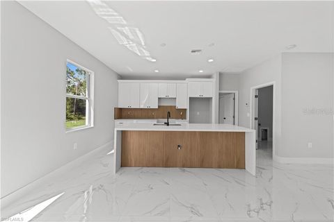 Photo of 967 Edgerton Avenue, Lehigh Acres, FL 33974 (MLS # A4686497)