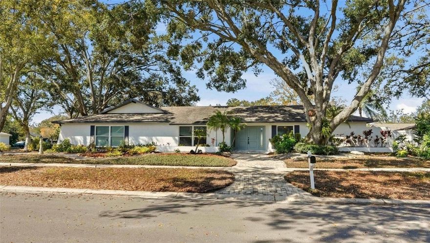 Under contract-accepting backup offers. Exquisite Renovated Pool Home – A Clearwater Sanctuary! Discover this beautifully remodeled 4-bedroom, 3-bath pool home perfectly positioned on a desirable corner lot in one of Clearwater’s most sought-after neighborhoods. Blending modern elegance with everyday comfort, this expansive move in ready residence offers a thoughtfully designed split-bedroom layout and seamless indoor–outdoor living. At the heart of the home is a fully renovated designer kitchen featuring sleek modern cabinetry, gleaming quartz countertops, stainless steel appliances, a striking designer backsplash, with a unique brick arched breakfast bar. New luxury vinyl flooring flows throughout, enhancing the home’s warm, sophisticated feel. Multiple living spaces provide flexibility for entertaining and relaxation. The formal living room showcases a charming wood burning stove with views of the sparkling pool, while the spacious family areas offer effortless flow to the outdoor oasis. The private Primary Suite is a serene retreat with tranquil views, a generous walk-in closet, and a spa inspired ensuite bath with dual vanities. Step outside to your own backyard paradise—complete with a shimmering pool, brand new vinyl fencing for enhanced privacy, and plenty of space to unwind or entertain. Ideally located near Chi Chi Rodriguez Golf Club and Countryside Country Club, you’re just minutes from premier golf, shopping, dining, and Clearwater’s award-winning beaches. Both Tampa International and St. Pete–Clearwater airports are a short drive away. Situated high and dry with no flood insurance required, this home delivers the best of Florida living—style, comfort, and convenience in one exceptional package.