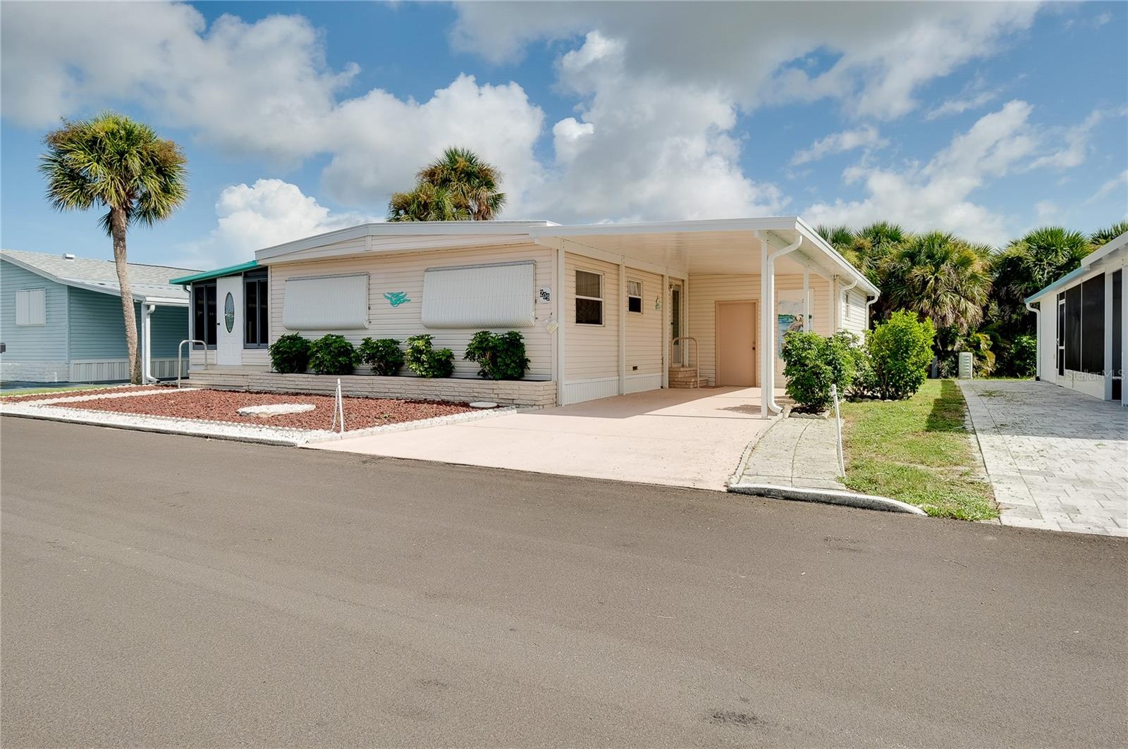 Welcome to Venice Isle, one of Venice’s premier 55+ resort communities! This beautifully maintained 2-bedroom, 2-bath home offers comfort, style, and peace of mind with major updates already completed. Enjoy a brand new membrane roof (2025), new carport, and new gutters. The enclosed Florida Room features wind resistant windows, providing a perfect space to relax year- round. The 2020 AC system ensures energy-efficient comfort. Inside, the spacious primary bedroom suite features a walk-in shower, while the 2 bedroom offers a bathroom with dual sinks and walk in shower perfect for guests. This home is move-in ready and designed for easy Florida living. You will love the large shed that includes the washer and dryer plus a workshop area ideal for hobbies, projects, or extra storage. Located in a quiet community, this home is perfect fulltime resident 55+ or seasonal retreat. The park amenities are numerous and include 2 heated pools, 2 hot tubs, putt putt golf, a fitness center, tennis courts, bocce ball, corn hole, horseshoes, billiards, ping pong, game room, Tiki Hut, 2 Clubhouses, and free community bus transportation to local shops and outings. There are also numerous activities and social events for all community members to take part in. The low HOA Fee includes Cable TV and Internet, Lawn Maintenance and all amenities. Located just minutes from downtown Venice and pristine beaches with easy access to shopping, dining, and other entertainment options. Whether you are enjoying a sunset stroll on the beach or exploring the charm of downtown Venice, this location offers the best of Florida living.