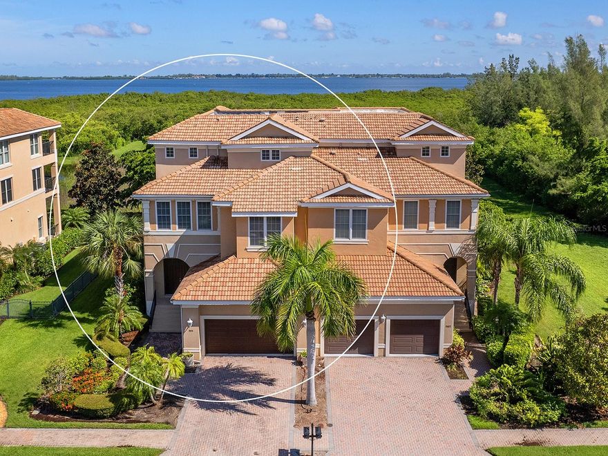 Beautiful 4/4.5 townhome overlooking Palma Sola Bay. 1st floor Great room is a perfect living room/game room. 2nd floor kitchen has all stainless appliances and granite countertops. Two bedrooms, laundry, living and dining all on second floor. 3rd floor master bedroom has walk in closets, separate tub and shower plus walk in closet. Additional bedroom, office/den and bathroom all on third floor. Private elevator. Oversized 2 car garage. Each floor has open balcony with water views on 2nd and 3rd floors. Minutes to Anna Maria Island and the beaches, restaurants and more!