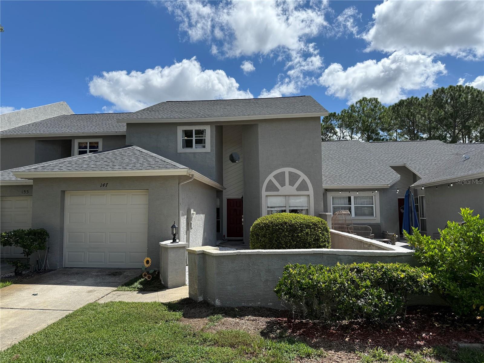 SPACIOUS UPDATED PALM HARBOR TOWNHOME. In popular STEEPLECHASE - low HOA and GREAT SCHOOLS. This beautifully updated townhome was completely redone in 2022 from the NEW ROOF to the luxury vinyl plank floors and everything in between. On entering, the first thing you notice is the soaring ceilings and the spacious 2nd floor loft. To your right, the dining room, with space for a large table and windows that overlook the front courtyard patio, to your left, the kitchen features plenty of storage, classy LIGHT GRAY CABINETS and gleaming GRANITE COUNTERS. Ahead of you the generously sized living area overlooks the SCREENED LANAI and shady back garden. Up the stairs you'll find the LARGE LOFT, 2 more bedrooms and a bath. Everything in the home was updated in the 2022 remodel. All new floors, cabinetry, counters, paint. New AC, TANKLESS WATER HEATER and new roof. Nothing to do but move in. Affordable $230 per month HOA includes lawn and landscape care, cable TV, grounds maintenance, community pool and cabana, and tennis courts. You will love the location of Steeplechase, too. Easy access to Countryside Mall, restaurants, medical facilities and a quick drive to Dunedin and the beaches of Honeymoon Island and the Causeway, Tarpon Springs is 20 minutes away and Anderson Park on Lake Tarpon is a 5 minute drive. All A rated schools. Don't wait - contact your agent to see this one today! ADDITIONAL PHOTOS WILL BE ADDED BY SUNDAY 9/7.