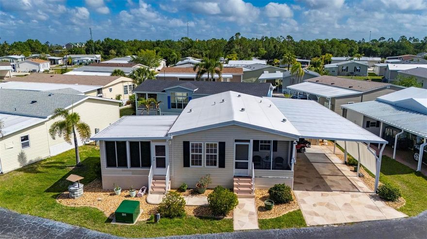 Welcome to this beautifully maintained 2-bedroom, 2-bath manufactured home located in a highly desirable 55+ community with a low HOA and an impressive list of included amenities. The HOA covers water, sewer, internet, cable, lawn care, on-site management, and maintenance staff, allowing for easy, worry-free living.
Residents enjoy access to a community pool, dog park, recreational facilities, shuffleboard, bocce courts, card room, billiards room, and so much more. Best of all, this home is not located in a flood zone, offering added peace of mind.
Built in 2006 and being sold furnished, this home features a spacious two-car carport with a beautiful stamped driveway and a very large attached workshop, perfect for hobbies or additional storage.
Inside, you’ll find a generously sized kitchen complete with solid wood cabinetry, a large center island, and stainless steel appliances—ideal for both everyday living and entertaining. The extended Florida room, added in 2010, includes easy-glide windows and its own A/C, providing additional comfortable living space year-round.
Both bedrooms are exceptionally spacious and feature custom-built wood drawer systems in the closets, maximizing storage and organization.
Additional updates include a membrane roof installed in 2023, adding to the home’s value and longevity.
This home offers the perfect combination of comfort, convenience, and community living—don’t miss this opportunity!