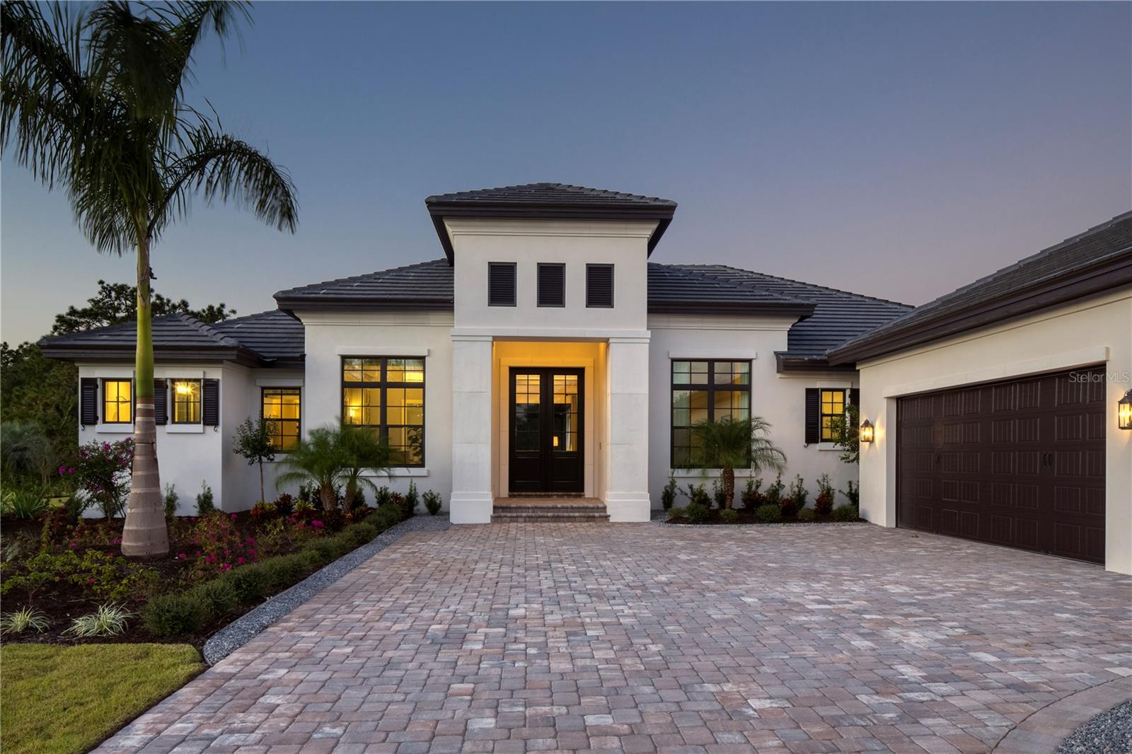 Pre-Construction. To be built. The award-winning, timeless and elegant Martinique Model by Roy Dupuis' Anchor Builders is available as a to be built on Lot 334 in Wild Blue at Waterside. This expansive 100' width of this rare, big water view Lapis homesite matches perfectly with Anchor Builders celebrated residential designer's resort lifestyle Martinique plan. Spectacular water and preserve views can be enjoyed with family and friends from most of the generously appointed interior spaces and in full view from the luxury resort styled outdoor pool ,spa, living, dining, and kitchen areas.
The Martinique Model has 4,007 sf of Living areas and includes a Great Room, 4 ensuite Bedrooms, one pool bath, one Study and one Flex Room with a 3-car garage. Builder Roy Dupuis and the design team can easily and will most likely, modify the floor plan and elevation to accommodate your individual lifestyle and tastes. In fact, in 36 years Roy Dupuis and the Design & Build Team have never built the same twice and many are pleased to hear the design and build team at Anchor Builders limits their builds to 8-10 a year. Your home, your way. Discover the Difference. Amenities at Wild Blue at Waterside will include a Clubhouse that will provide residents fine and casual dining, social events and a well-appointed fitness center, classes, personal training, golf simulator, movie theatre and more. The shared Midway Sports Center will include 13 acres for neighbors to explore, play and connect. Miles of lakeside and preserve walking paths and trails, 6 tennis courts, 8 pickleball courts, sports pro shop, kayak launch, playground and of course, 2 dog parks for our fury friends. All created for your next chapter nature-centric, active lifestyle! Available from $3,795,000. The List Price includes selected options and excludes additional options and upgrades shown in our model and brochure plans. Please consult the Builders Representative for additional details.