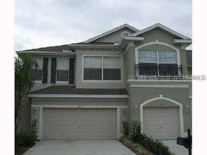 This Spacious end unit Townhome located in the sought after Pasco County Gated Community of Huntington Ridge, a fantastic and beautifully maintained Community that you will be proud to live in. Greet your friends and family at the North facing front door, welcome them into the foyer and the open floor plan setting with bright living area, fully equiped eat in kitchen with beautiful wood cabinets, breakfast bar, and formal dining area to the left of the stairway. Take note of the elegant crown molding on the vaulted ceilings and sliding glass doors to the lanai. There is also a half bath and a Den/Office/Study to the right of the foyer plus lighted storage under the stairs (no wasted space here) and the door to the full 2 car garage!  The stairway leads you to the 3 bedrooms, 2 full baths and the laundry room with washer and dryer provided. The unique kingsized Master Suite down the hall to the left offers a screened balcony overlooking the natural beauty of the conservation area, a huge walk-in closet plus masterbath with double vanity, a soaking tub, glass enclosed shower and a linen closet! All this and like new carpet and window treatments throughout! This secluded, single street, gated community of Huntington Ridge includes a gated pool and cabana for residents and a serene lake in a park like setting complete with picnic tables under big shade trees!! Located near Grocery and Retail shops as well as a variety of restaurants, the local library and ball fields! Travel just minutes East on St.Rd.54, that converts to St.Rd. 56 at the expansive Tampa Outlet Mall and the I 75 junction. Keep traveling straight to the Bruce B. Downs Blvd. corridor and The Shops at Wire Grass Mall! Travel West to St.Rd. 41 (aka Land O' Lakes Blvd.) and the Sun Coast Highway! You will love living in this well maintained townhome community, so don't make your decision until you have viewed this beautiful end unit in HUNTINGTON RIDGE of Land O' Lakes!