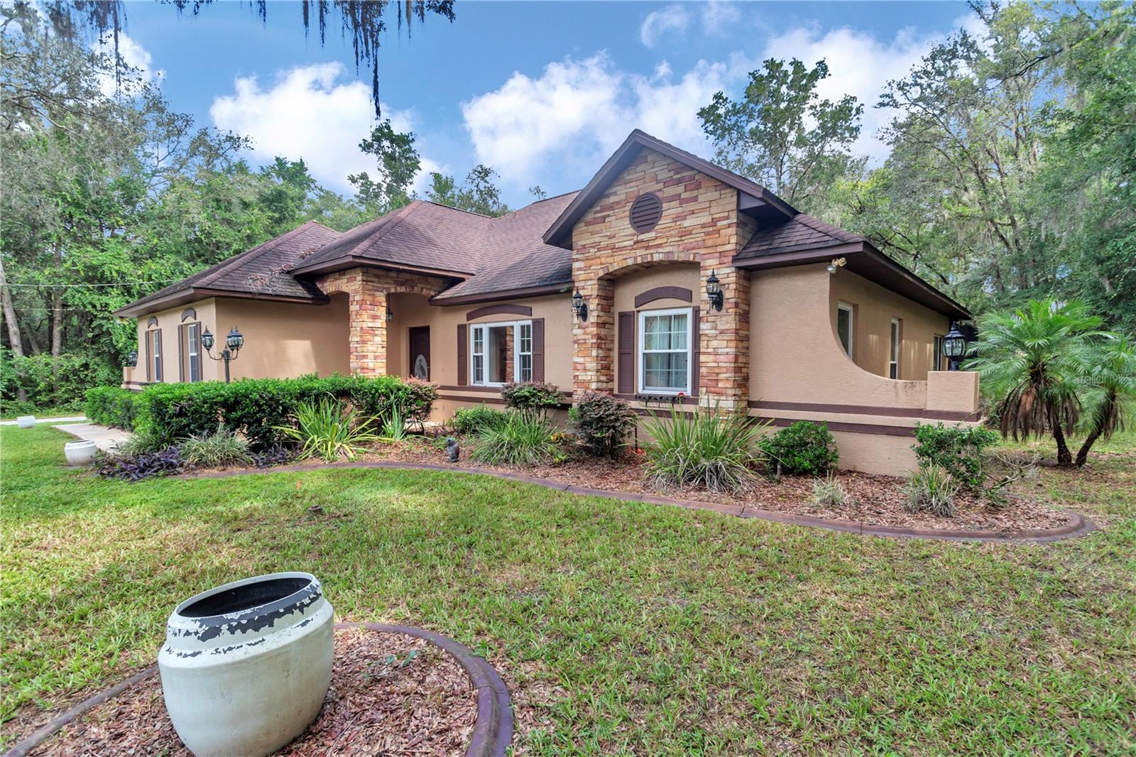 This spacious home offers the perfect blend of comfort and functionality. Enjoy your private pool, ideal for relaxing or entertaining, along with a versatile additional building featuring a carport, extra garage, and a screened-in room designed for gatherings with family and friends. With plenty of room inside and out, this property is a rare find that combines lifestyle, convenience, and endless possibilities