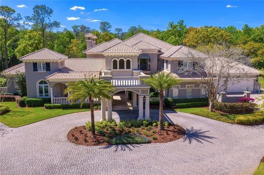 A Fechtel Company custom-built masterpiece with over 10,000 square feet of living space nestled on 14 acres in gated Turnbury Wood in the popular Tampa Palms community.  Turnbury Wood is an exclusive village in Tampa Palms of only four homes--all on multi-acre homesites.  In addition to the formal living room, dining room, kitchen, family room and casual dining, this home also features six bedrooms all with ensuite bathrooms, two half bathrooms, an office, billiards/game room, children's playroom, home theater, a loft, a home gym, wine cellar, crafts room and garages large enough to park seven cars.  Spectacular pool and spa overlook stocked fishing pond and your very own wooded sanctuary.  The extensive trim molding, travertine and wood flooring, stone columns, and many more fine details showcase this exquisite property.  The gourmet kitchen features professional-grade appliances including a Thermador gas cooktop and ovens and a SubZero refrigerator.  The wine cellar holds up to 800 bottles of wine.  Guest accommodations include two semi-detached suites.  One with a loft above and the other adjacent to the home gym and overlook the gleaming pool and spa.  this home also features two gas fireplaces, a summer kitchen on the lanai, complete with a new Alfresco grill and a Big Green Egg, a safe room, a technology/security room, storage galore, a drop zone for the kids, an 18x12 laundry room with loads of storage and a mop/utility sink, a new sport court, a putting green with sand trap to work on your short game, gazebo, a stocked fishing pond with fountain, whole home technology and music system and so much more.  Tampa Palms is conveniently located near one of the top elementary schools in Hillsborough County, Chiles Elementary.  Also, close by you will find plenty of shopping, dining and recreation.  The Tampa Palms Country Club is one of the finest in the Tampa Bay area and served as one of the stops on the Champions Tour (known as the Senior Tour at the time).  A short drive to the University of South Florida, the James A. Haley VA Hospital, the Moffitt Cancer Center, Busch Gardens, Tampa Premium Outlet Mall, Wiregrass Mall, Shoppes at Wiregrass and a short commute to downtown Tampa.