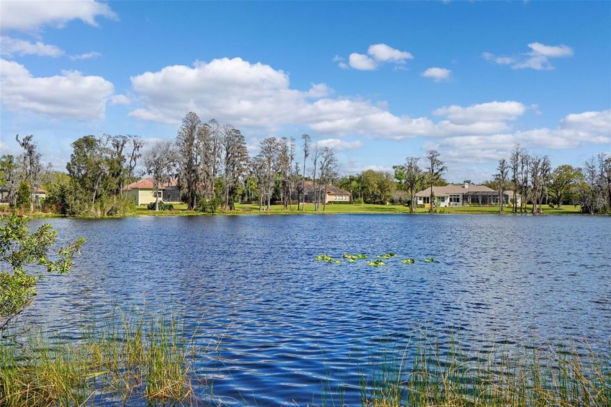 Located in Odessa’s highly sought-after Lake Keystone area, 18709 Wayne Rd offers a rare opportunity to secure a valuable lakefront homesite surrounded by some of Northwest Hillsborough County’s most impressive custom estates and multi-million-dollar waterfront residences. This coveted stretch of Odessa has become known for its expansive lakefront properties where luxury homes valued well into the seven-figure range line the shoreline, creating a setting that reflects both prestige and long-term value. The true value here lies in the land and the exceptional setting—an increasingly rare chance to own a sizeable lakefront parcel in one of the Tampa Bay area’s most desirable waterfront communities. The property spans approximately 1 to 1.5 acres (with a portion extending into the lake), offering ample space to design and build a custom lakefront residence that takes full advantage of the water views and natural surroundings. Mature trees, wide open lake vistas, and the generous lot create the kind of setting discerning buyers seek when building a luxury estate. The Lake Keystone area is widely recognized for its large homesites, private waterfront estates, and a collection of striking custom homes that contribute to the area’s reputation as one of Odessa’s premier lakefront enclaves. Many neighboring properties showcase significant architectural investment and high-end design, reinforcing the strong desirability and enduring value of the community. The property currently includes an existing residence along with a true Cold War–era conversation piece—an above-ground mid-century bomb shelter. With a little imagination, this unique structure could be repurposed as a workshop, studio, secure storage space, wine cellar, hobby room, or simply remain a one-of-a-kind feature that sparks conversation with guests. Despite its tranquil, estate-like setting, the property is conveniently located just minutes from the Veterans Expressway, providing easy access to Tampa International Airport, downtown Tampa, shopping, dining, and the greater Tampa Bay area. Opportunities to acquire lakefront land of this size in the Lake Keystone area—especially among surrounding luxury estates—are increasingly rare. Whether renovating the existing home or creating a new custom residence, this property presents the chance to establish a signature lakefront estate in one of Odessa’s most iconic waterfront communities. DO NOT STEP ON THE REAR DECKS — THEY ARE UNSTABLE AND UNSAFE.