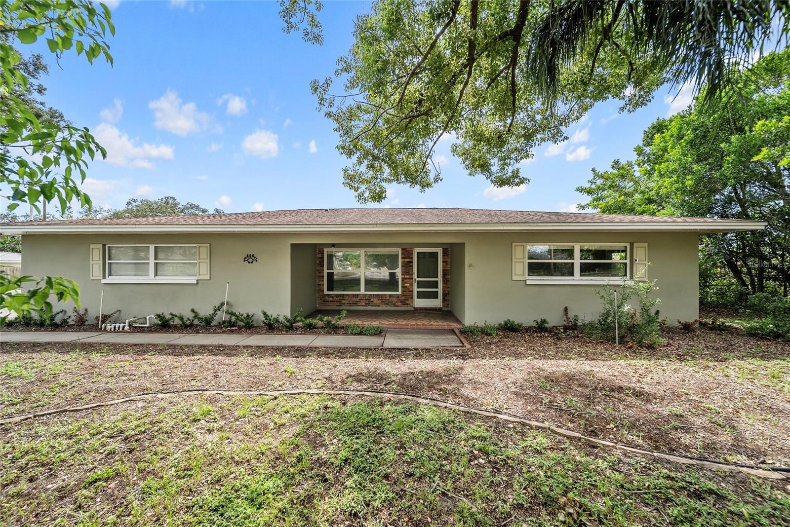 Welcome to this beautifully maintained, move-in ready 3-bedroom, 2-bathroom home with a bonus room, situated on an oversized corner lot in a desirable Clearwater location! As you enter, you’re welcomed by a spacious bonus room—perfect as a home office, playroom, or additional living space. The large great room offers an open, inviting area ideal for both relaxation and entertaining. The bright kitchen features solid wood cabinetry, generous counter space, and a large closet pantry. An interior laundry room is conveniently located just off the kitchen. Enjoy tile and laminate flooring throughout—no carpet! Step outside into the expansive backyard, complete with a screened-in porch, two large paver patios, and a storage shed—perfect for outdoor gatherings and everyday living. With nearly 2,000 square feet of living space, this home offers three comfortable bedrooms, two full bathrooms, plenty of closet space—including a cedar-lined closet—and a full attic for additional storage. Conveniently located near major roads, shopping, dining, and just minutes from Clearwater’s world-famous Gulf Beaches.