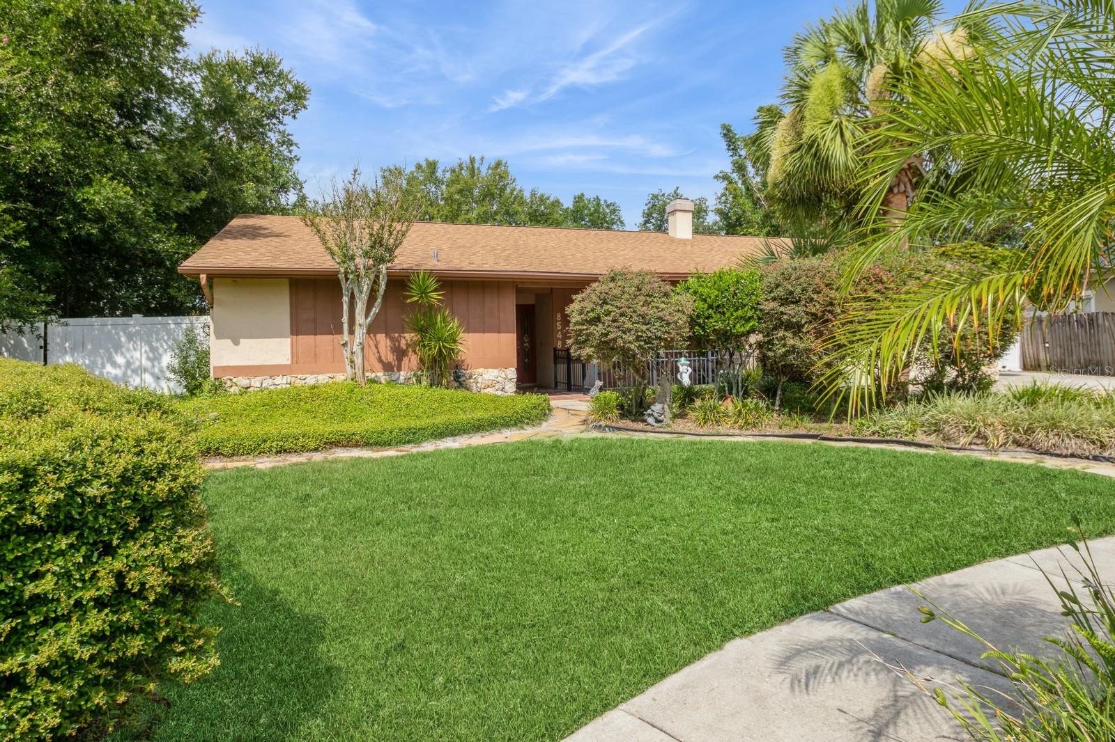 Welcome to your TROPICAL PARADISE IN the Heart of Dr. Phillips. This 5bd/3.5BA 2711 sq. ft. one-of-a-kind POOL home is in SAND LAKE HILLS. The spacious home features an IN-LAW-SUITE. Blending indoor comfort and outdoor living on an expansive lot makes this a perfect Family Home. Enjoy morning coffee on the front patio on this quiet street. As you enter the home, you will find an open Family Room and Kitchen area. The family room features a stone wood-burning fireplace and French doors to the courtyard. The updated kitchen features Corian counters, wood cabinets, stainless steel appliances, and room for a table or an island. Enjoy the great view of the Florida Room and Backyard Oasis. The living/dining room has easy access to the Florida Room. Enjoy the view of the side yard through the sliding glass doors in the Primary Bedroom. Primary Bath features Double vessel sinks with granite counters, and a walk-in shower. The IN-LAW SUITE features a living room with exterior access and a separate bedroom and bath. Split Bedroom plan with three bedrooms and one Bath on the other side of the home. Entertain family and friends in your TROPICAL RETREAT with a Resort-style sparkling pool/spa, gazebo SUMMER KITCHEN, and massive FIRE-PIT AREA. The huge backyard is perfect for GARDENING, A PUTTING GREEN, GAMES, and so much more. Enjoy relaxing around the spacious deck of the pool/spa. The large built-in SUMMER KITCHEN is perfect for Bar-B-Ques and will be the envy of your friends. Enjoy SMORES around the Fire Pit. The property includes two sheds and a concrete pad, perfect for a boat or car. The Fenced-in Yard provides safety and privacy. Sand Lake Hills is located in the heart of Dr. Phillips. It is close to Dr. Phillips YMCA, Restaurant Row, Shopping, Theme Parks, Downtown Disney, OTOWN West, Churches, Shopping, and Schools. Easy access to major highways and Orlando International Airport; as well as the East and West Coast Beaches, and Downtown Orlando. Hurry, schedule a private appointment today.
NEW ROOF IN 2021 AND RE-PIPED IN 2009