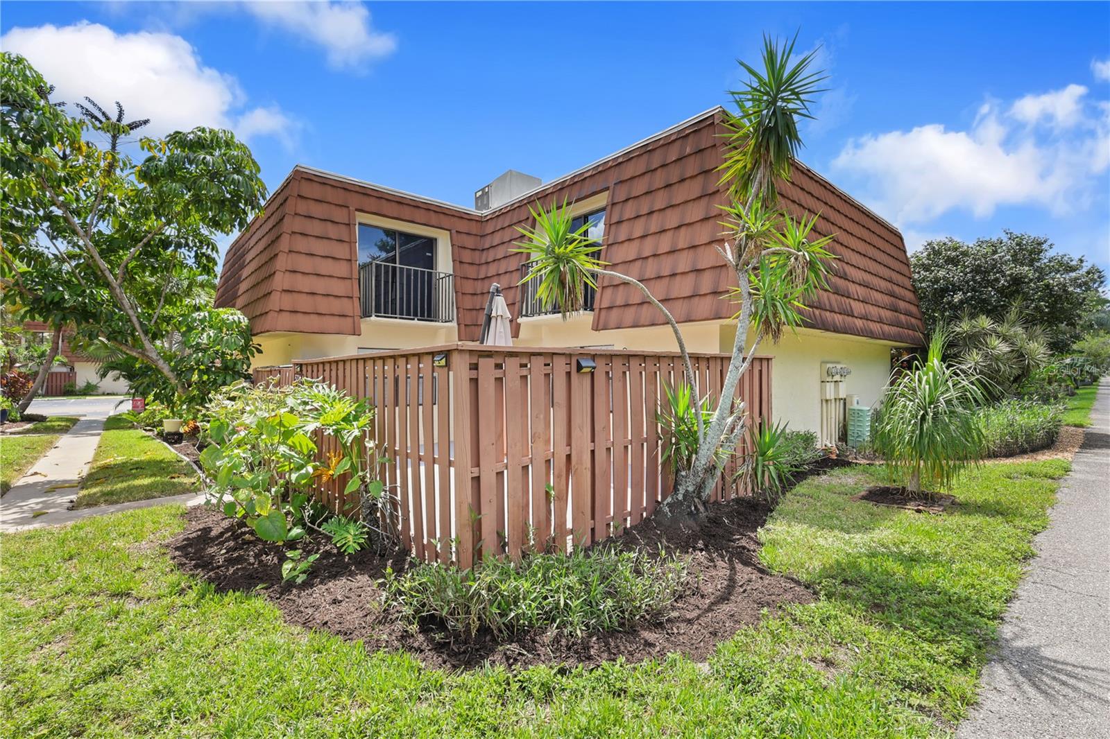 Discover this beautifully updated 2-bedroom, 2-bathroom townhome in the highly sought-after Cedarbend community, offering a perfect blend of style, comfort, and convenience. Tucked away in a quiet location at the back of the neighborhood, this home provides a peaceful setting with direct access to the community’s walking path—perfect for enjoying the outdoors or strolling with your furry friends. Step inside to find a light-filled open layout featuring a stunning kitchen with granite countertops, stainless steel appliances, bar seating, and a stylish backsplash. The dining area flows seamlessly into the living space, creating an ideal setup for both entertaining and everyday living. Downstairs boasts 20-inch tile flooring throughout, plantation shutters, and a fully renovated bathroom with luxury tile and modern finishes. Upstairs, both bedrooms offer private balconies for enjoying morning coffee or evening breezes, along with a second beautifully updated bathroom. A spacious, fenced-in courtyard provides the perfect outdoor retreat for relaxing or entertaining guests. Additional updates include a WiFi-enabled washer and dryer and countless modern touches throughout. Cedarbend residents enjoy low HOA fees covering exterior insurance (including the roof), pest control, lawn care, and access to the community pool. With two assigned parking spaces and a location just minutes from FSW, beaches, shopping, dining, and entertainment, this move-in-ready townhome delivers the best of Fort Myers living in a central, well-maintained community.