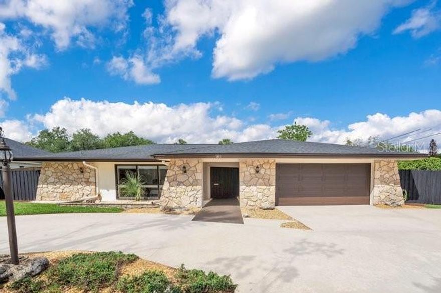 *Professional photos coming soon* Welcome to Carisbrooke, an exclusive gated enclave of just 43 estates set on sprawling one-acre homesites within the sought-after Markham Woods Corridor. Surrounded by scenic walking trails, community parks and the refined charm of the Lake Mary lifestyle, this exceptional location offers effortless access to major interstates and beltways, placing world-class attractions, pristine beaches and top-tier regional hospitals all within easy reach. From the moment of arrival, a beautifully maintained landscape, fresh designer exterior paint and an elegant circular drive create a striking first impression, leading to grand custom double entry doors. Inside, a dramatic introduction unfolds as floor-to-ceiling windows to frame serene views of the lanai and resort-style pool, while rich travertine flooring and intricate applied moldings elevate the home’s architectural presence. The interior has been lavishly reimagined with uncompromising attention to detail. The chef’s kitchen is a true showpiece, appointed with Sub-Zero and Thermador appliances, bespoke cabinetry and exotic granite surfaces. Distinctive design elements, including an Invisacook cooktop and a Waterstone copper faucet set above an impressive 42-inch sink, create both visual intrigue and functional excellence. The adjoining family room, anchored by a custom-built entertainment center, flows seamlessly to the outdoor living spaces. The primary suite is a private retreat, offering rich hardwood flooring and a beautifully renovated spa-inspired bath designed for relaxation and indulgence. Three additional bedrooms are thoughtfully positioned on the main level, while the fifth bedroom and a generously sized bonus room upstairs provide exceptional flexibility for lifestyle, entertainment or leisure. Outdoors, the experience continues with a newly installed limestone paver pool deck overlooking an expansive, meticulously manicured backyard. A striking 10-foot granite firepit and a custom pergola set the stage for unforgettable evenings under the stars. Completing the residence is an oversized three-car garage with extended driveway parking, along with new mechanical systems, updated designer fixtures and whole-house audio, delivering a truly turnkey, move-in-ready estate defined by luxury, comfort, and the incredible Florida lifestyle.