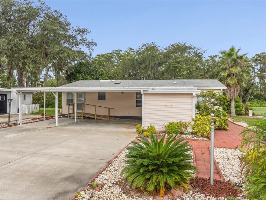 BACK on MARKET - Buyer Financing Fell Thru - Florida Living within 15 minutes of Disney and OWN YOUR OWN LAND.  Low HOA & Low Taxes.  Plumbing and Electrical are both updated.

Must go Conventional 20% down or CASH due to subdivision not qualifying for Fannie Mae or HUD at this time. It may in the future, but not at this time.

This home sits on 4th hole  of Polo Park West subdivision just off Hwy 27.   All appliances replaced within last 5 to 7 years.  New screens on the back lenai.  Front & glass door are newer.  AC & Hot Water Heater are less than 5 yrs old.  Newer underpinning as well. No flood insurance required.

Large carport on the front for parking and/or sitting.