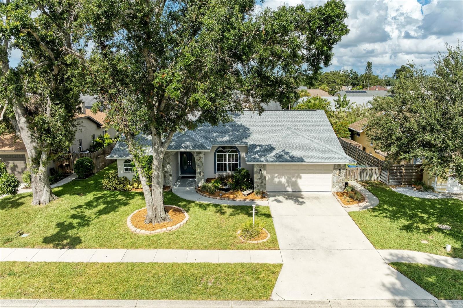 One or more photo(s) has been virtually staged. Welcome to 4488 Diamond Circle E, Sarasota and experience the perfect blend of privacy and togetherness with a thoughtfully designed split floor plan. Step into a world of elegance and comfort in this stunning single-family retreat nestled in the heart of beautiful Sarasota! This meticulously updated 3-bedroom, 2-bathroom home offers not just a place to live, but a lifestyle designed for relaxation and entertainment. The spacious layout ensures that both entertaining and quiet family time are beautifully accommodated. Gather around the charming wood-burning fireplace in the family room, where cozy evenings and cherished memories await. This inviting space is perfect for movie nights or intimate gatherings. Retreat to the serene primary suite, where a renovated spa-like bathroom awaits. Indulge in a long soak in the luxurious soaking tub or refresh in the spacious walk-in shower. This thoughtfully designed sanctuary is your private escape from the world. Slide open the doors from the living room, family room or primary bedroom to your private lanai, where seamless indoor-outdoor living comes to life. Bask in the sun by the sparkling pool or unwind in the bubbling spa. The built-in outdoor kitchen and grill area make hosting summer barbecues a breeze, while the fire pit invites cozy evenings under the stars in your fully fenced backyard. This home is an entertainer’s dream! The expansive outdoor space is perfect for hosting friends and family, ensuring every gathering is memorable. New Roof 2023. Low HOA and no CDD fees.
Emerald Gardens neighborhood is designed away from major roads and is perfect for walking your dog away from traffic with a large lake in the center with a peaceful setting looking over the lake with a fishing dock. This is a community of lush landscapes, and proximity to the best of Sarasota. Explore nearby parks, pristine beaches, dining and shopping options, all just a short drive away. Embrace the local lifestyle that Sarasota has to offer, from arts and culture to outdoor adventures.
This remarkable home is the essence of Florida living. Whether you’re looking to settle down in a tranquil community or seek a fantastic investment opportunity, this property is an absolute must-see!
Schedule a private showing today and step into the lifestyle you’ve always dreamed of!