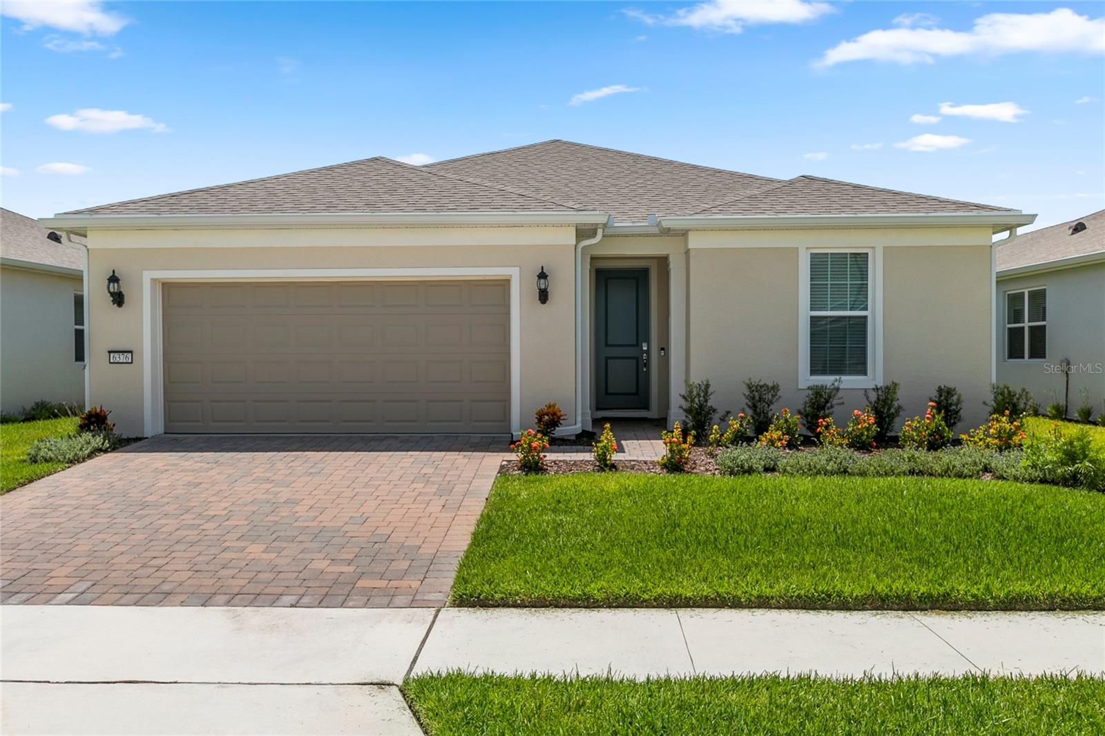Welcome to Del Webb Sunbridge, a 55+ active adult community offering state-of-the-art resort-style amenities and a low-maintenance lifestyle! An on-stie Full Time Activities Director plans social events throughout the year as well as daily classes and activities which are centered around the 27,000 square foot clubhouse. Clubs, Art classes, Fitness classes, Pickle Ball, Tennis, Lap Swimming, concerts, or just relaxing around the resort style pool or at the on-site Tavern & Grill await you! You will love that the lawn maintenance is included in the community HOA dues. This home offers energy efficient features such as natural gas for the range, tankless water heater, and dryer as well as Low-E Dual Pane Vinyl Windows, R-30 insulation, Off-Ridge Vent & Flow-Thru Soffit Systems for effective attic ventilation, Digital Programmable Thermostat, & Radiant Barrier. The Prosperity floor plan offers 2450 total square feet including 1781 heated square feet with a split floor plan for privacy. The generous guest bedroom and bathroom are at the front of the home while the stunning primary suite is at the back of the home. A lovely den with solid French doors is in the middle of the home. A spacious open kitchen and great room with adjoining sunroom finish this perfect plan! You will love the dedicated laundry room with washer, dryer, cabinets, sink, and yes, a laundry wall drop from the primary bath suite. The entire home has a lovely Coastal color scheme with wood-looking light gray/beige tile, light brown cabinets throughout, white quartz countertops, a white kitchen farmhouse sink, stainless steel appliances and hardware throughout, lovely la-fleur mosaic kitchen backsplash for a pop of color, and gorgeous 8 ft. craftsman interior doors. Did I mention the spacious back-covered porch and backyard! Every detail of this home was planned for low maintenance and easy living. This is Central Florida Living at its best! Call today for a private showing!