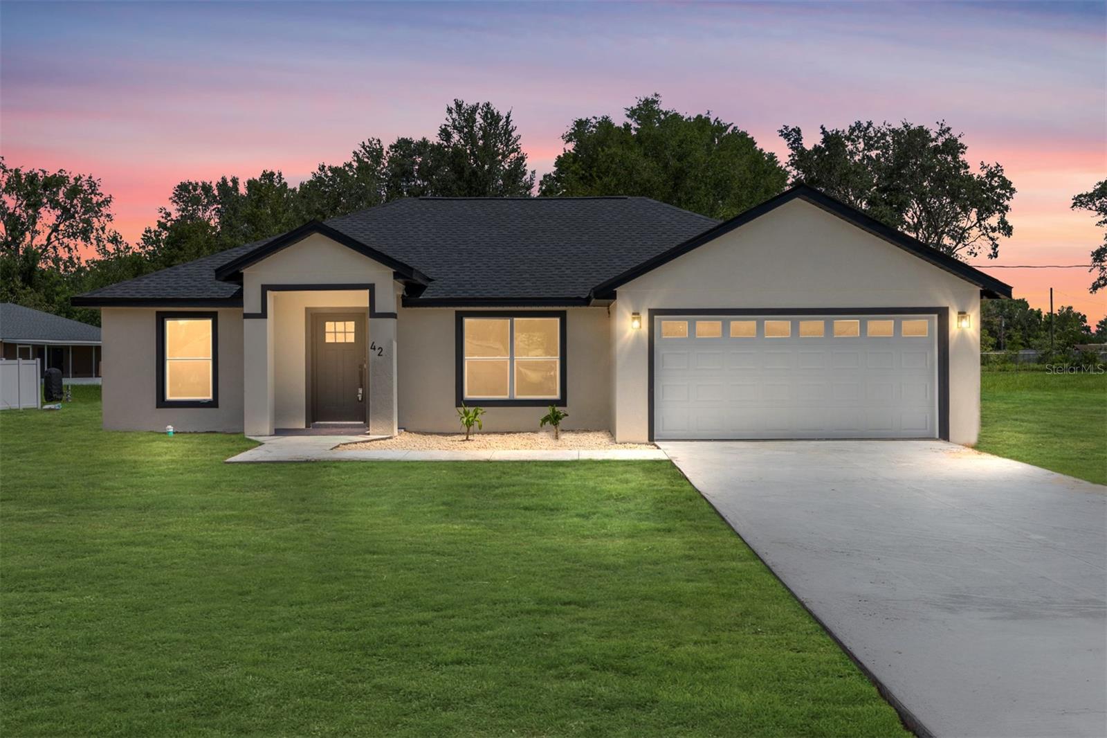 One or more photo(s) has been virtually staged. Modern farmhouse new construction on an oversized 0.43-acre lot with no HOA. This thoughtfully designed 3-bedroom, 2-bath home offers 1,393 sq. ft. of living space, a 2-car garage, and is filled with high-quality finishes throughout.
Step inside to an open layout featuring luxury vinyl plank flooring, vaulted ceilings, and dimmable recessed LED lighting. The kitchen includes sleek quartz countertops, a spacious island, soft-close cabinetry, and stainless steel appliances. The warm, clean design and fixtures give the home a welcoming modern farmhouse feel.
The split-bedroom layout provides privacy, and the primary suite offers a walk-in closet, double vanities, and a tiled walk-in shower. Additional features include ceiling fans in all bedrooms, a garage door opener, and a back covered porch overlooking the expansive backyard.
Conveniently located just minutes from Maricamp Road, with quick access to Walmart, Aldi, Walgreens, and more. No HOA or CDD. FHA, VA, and conventional financing welcome.
This is a rare opportunity to own a brand-new home on nearly half an acre in a growing area of Ocala. Schedule your private showing today!