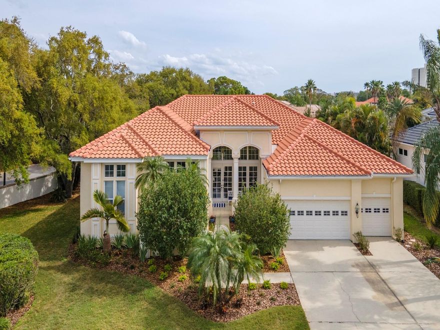 Welcome to the private gated wonders of Pasadena Yacht and Country Club. Established in 1924, the club features a championship 18-hole golf course, a clubhouse with multiple dining options, tennis, pickleball and a marina, and is the only gated private country club with both golf and marina in Pinellas County. You will feel at home as soon as you walk into this beautifully updated single-story, four-bedroom, four-and-a-half-bath home on a large lot within the confines of the Pasadena Yacht and Country Club. The foyer's soaring 14-foot ceilings lead you to 12-foot ceilings in the living room, primary suite, library, family room and kitchen, all with transom windows. The lot was selected for its orientation to the sun. At almost 4,000 square feet, this home is perfect for entertaining or for a large family. The kitchen is a chef’s kiss featuring an island with a Wolf gas cooktop and a second island for entertaining with seating for nine. Blanco sink, marble counters, new lighting and loads of storage, seamless glass windows with pool views. The kitchen has room for a table for eight and is open to the family room with a fireplace. With sliders to the owner's suite, the living room and family room are open to the lanai, sparkling pool and spa. The home creates a perfect space for entertaining large crowds or intimate gatherings. The owner's suite is a luxurious sanctuary with a sitting area, three closets and a spa. Recently updated, the bath features white marble flooring, spa tub, double rainfall shower, new seamless glass enclosure, new vanities with quartz counters, square designer sinks, and a private room with a toilet and bidet. Next to the owner's suite is a bonus room with a marble half bath that could be used as a home office, library, music room, nursery or playroom. Privacy is key to this home, with a split floor plan of three additional bedrooms on the opposite side of the home. The guest suite is newly carpeted with a private bath and access to the pool. Two bedrooms each have ensuite baths and walk-in closets, all with new fixtures. There is plenty of storage in the home including a huge storage room and brand new laundry room just as you enter the home from the large three-car garage. Recent updates include Brazilian cherry hardwood floors (2018), marble counters and a new solid wood cabinet kitchen (2020), barrel tile roof (2021), new luxury landscaping, 75-gallon gas water heater, interior/exterior paint, primary vanities, shower door, quartz counters, faucets, showerheads, laundry room storage, pool decking, all new window screens, pool screens and door, electrical, lightning fixtures, LEDs, hardware in all baths, window treatments, carpet, pool pump (2023). Whether you love to golf, boat, cook, entertain or all the above, this home offers it all. Centrally located near the Gulf beaches, and downtown St. Pete has become a foodie's paradise. It started with Parkshore Grill and now has a multitude of dining options. Sports abound with our beloved Tampa Bay Rays, Rowdies, Bucs and the Lightning and galleries and museums fill the city with beautiful art including the Museum of Fine Arts, the Dali Museum, and Duncan McClellan Galleries and more. The Florida Orchestra and the St. Pete Opera Company are a feast to your senses, adding to the treasures of this wonderful city. Bedroom Closet Type: Walk-in Closet (Primary Bedroom).