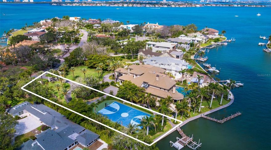 An exceptionally rare opportunity to secure a prime waterfront homesite in Sarasota’s most coveted neighborhood, Harbor Acres. Spanning approximately 35,000 square feet with 115 feet of waterfront, this expansive parcel offers the ideal canvas to create a custom residence in a location where new build opportunities are increasingly scarce. Positioned adjacent to a premier bayfront estate and currently improved with a private sport court, the property is surrounded by multi-million-dollar homes and mature tropical landscaping, offering the potential for stunning water views and seamless access to Sarasota Bay. With generous dimensions and a prestigious address just minutes from downtown Sarasota, Southside Village, and the Gulf beaches, this is a true legacy offering, an opportunity to build new in one of the city’s most iconic and tightly held enclaves, where opportunities like this are nearly impossible to come by. The adjacent estate at 1423 Hillview is currently offered separately, with the opportunity to purchase both together. Bank sign-off on the sale of this property may be required. The gate and driveway will need to be reconfigured.