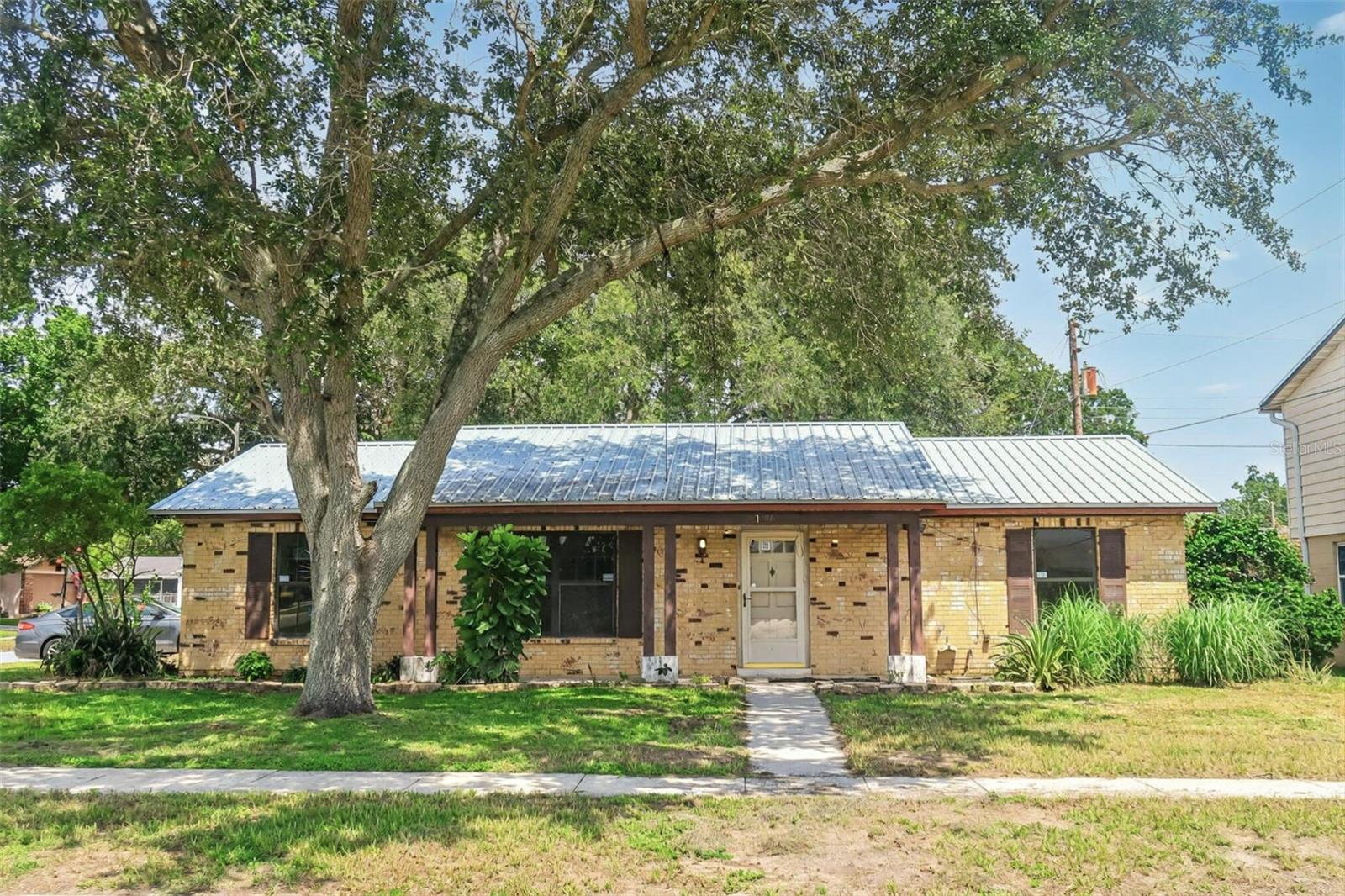 Welcome to 1706 Dana Pl in Lakeland. This 4-bedroom, 2-bathroom home includes a bonus room, laundry room, and workshop room. Built with 1,799 sqft of living space, the property is situated on a nice corner lot. Features include a newer metal roof. The home is being sold as-is and will need a new AC and interior cosmetic updates.