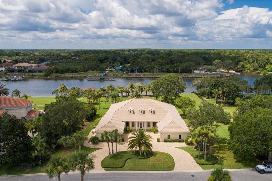 Welcome to this stunning home nestled in the heart of Florida's sunny paradise. This elegant residence embodies the essence of luxurious coastal living, offering a perfect blend of comfort, style, and breathtaking surroundings. As you enter, you are greeted by an inviting foyer with an abundance of natural light streaming through large windows. The spacious open floor plan seamlessly combines the living, dining, and kitchen areas, creating a warm and welcoming atmosphere for entertaining guests or enjoying quality time with loved ones. The great room boasts soaring ceilings and features a wall of glass doors that lead to a private oasis. Step outside onto the expansive patio, where a sparkling swimming pool awaits, surrounded by lush tropical landscaping and swaying palm trees. This covered outdoor haven offers the perfect setting for relaxation and outdoor gatherings. The gourmet kitchen is a chef's dream, equipped with top-of-the-line stainless steel appliances, custom cabinetry, and a generous island with a breakfast bar and butler’s pantry. Whether you're preparing a casual meal or hosting a grand feast, this culinary haven provides both functionality and style. The master suite is a true sanctuary, offering a serene retreat from the world. With its scenic views, spacious layout, and plush carpeting, it is a haven of tranquility. The en-suite bathroom features a luxurious soaking tub, a walk-in shower, and vanities, exuding an air of opulence and relaxation. Additional bedrooms and bathrooms are thoughtfully designed to provide comfort and privacy for family members and guests alike. A dedicated home office space with private entrance to the outliving living areas is the perfect environment for productivity and inspiration. Located in the spectacular Island Estates Neighborhood of Hammock Dunes, this home offers convenient access to pristine sandy beaches, world-class golf courses, and a vibrant cultural scene. With its proximity to the ocean and a myriad of recreational activities, it presents an incredible opportunity to embrace the coveted Florida lifestyle. This beautiful home in Florida is truly a masterpiece, combining exquisite design, impeccable craftsmanship, and a desirable location. It invites you to indulge in the epitome of coastal living, where every day feels like a vacation in paradise.